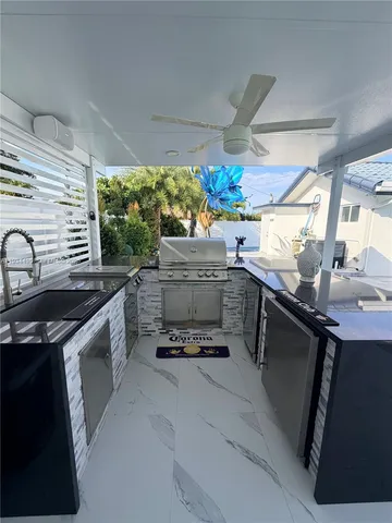 a kitchen with stove and cabinets