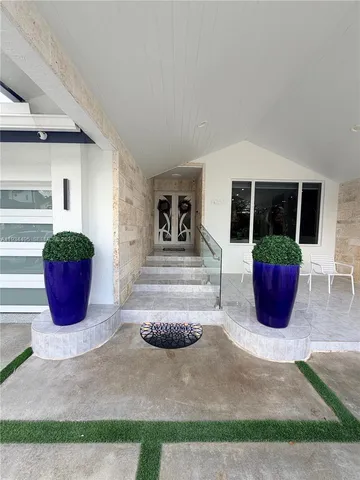 a view of a entryway with table and chair
