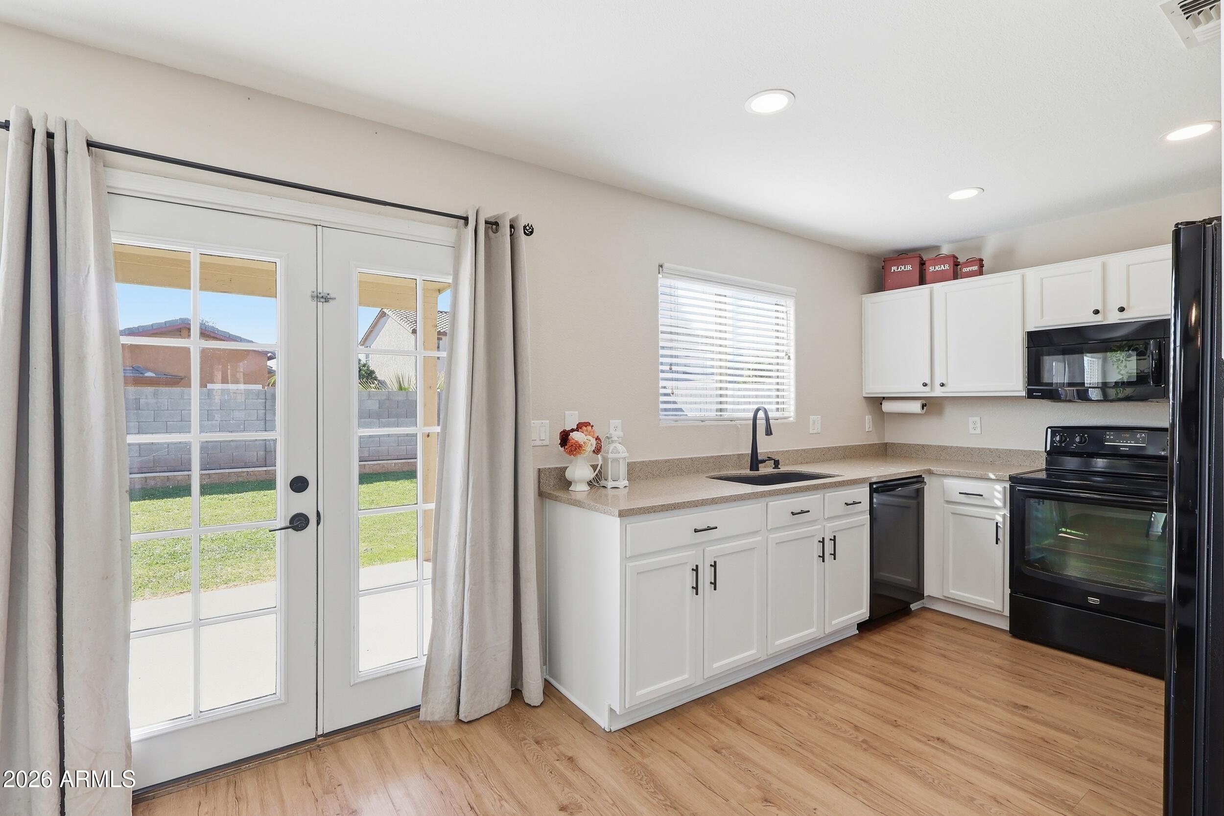 17449 West Calavar Road Surprise, AZ 85388 - Photo 10 of 33 16 - Kitchen
