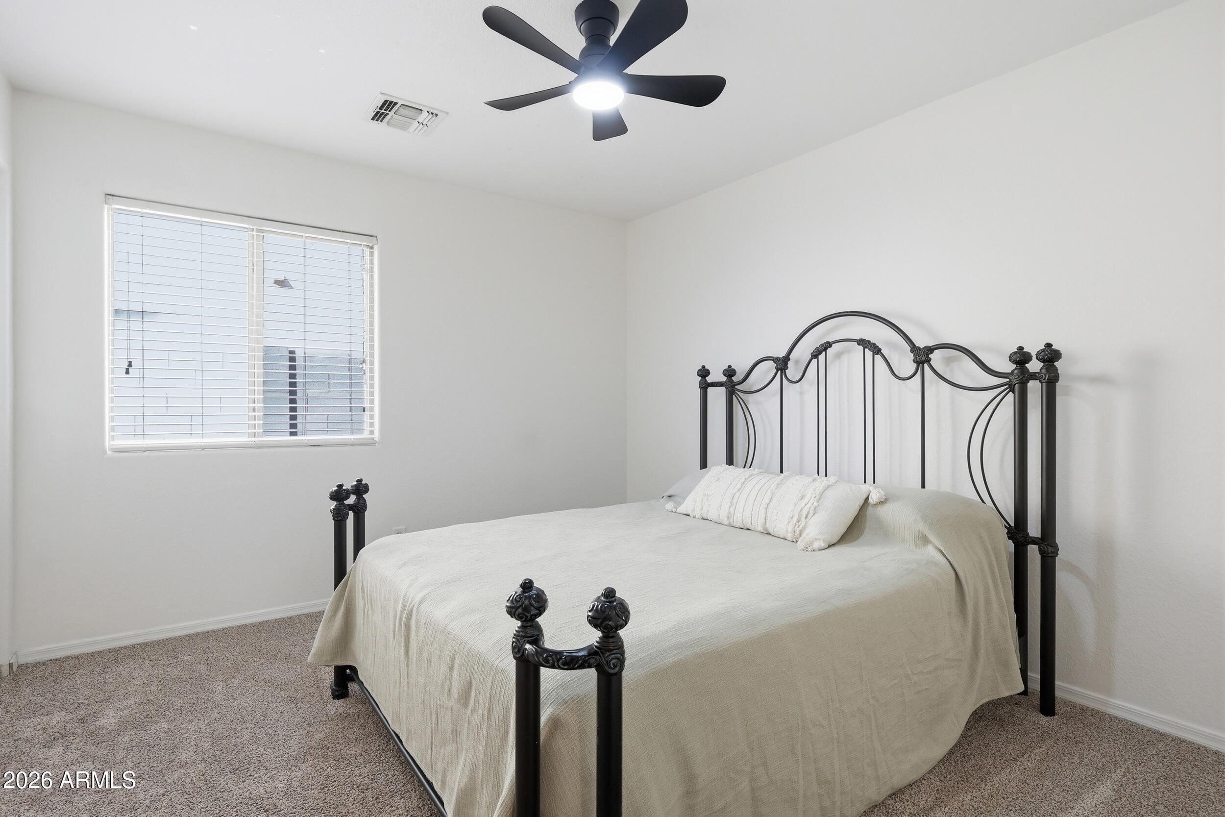 17449 West Calavar Road Surprise, AZ 85388 - Photo 14 of 33 21 - Bedroom 2