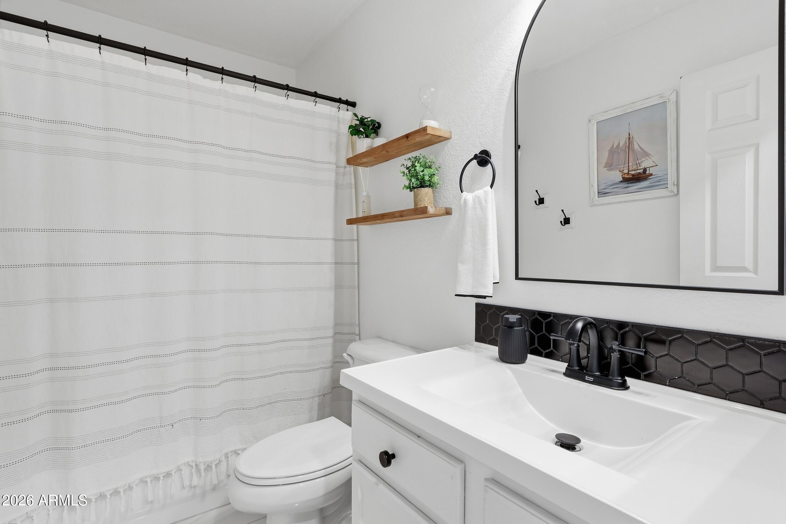 17449 West Calavar Road Surprise, AZ 85388 - Photo 16 of 33 23 - Hall Bath