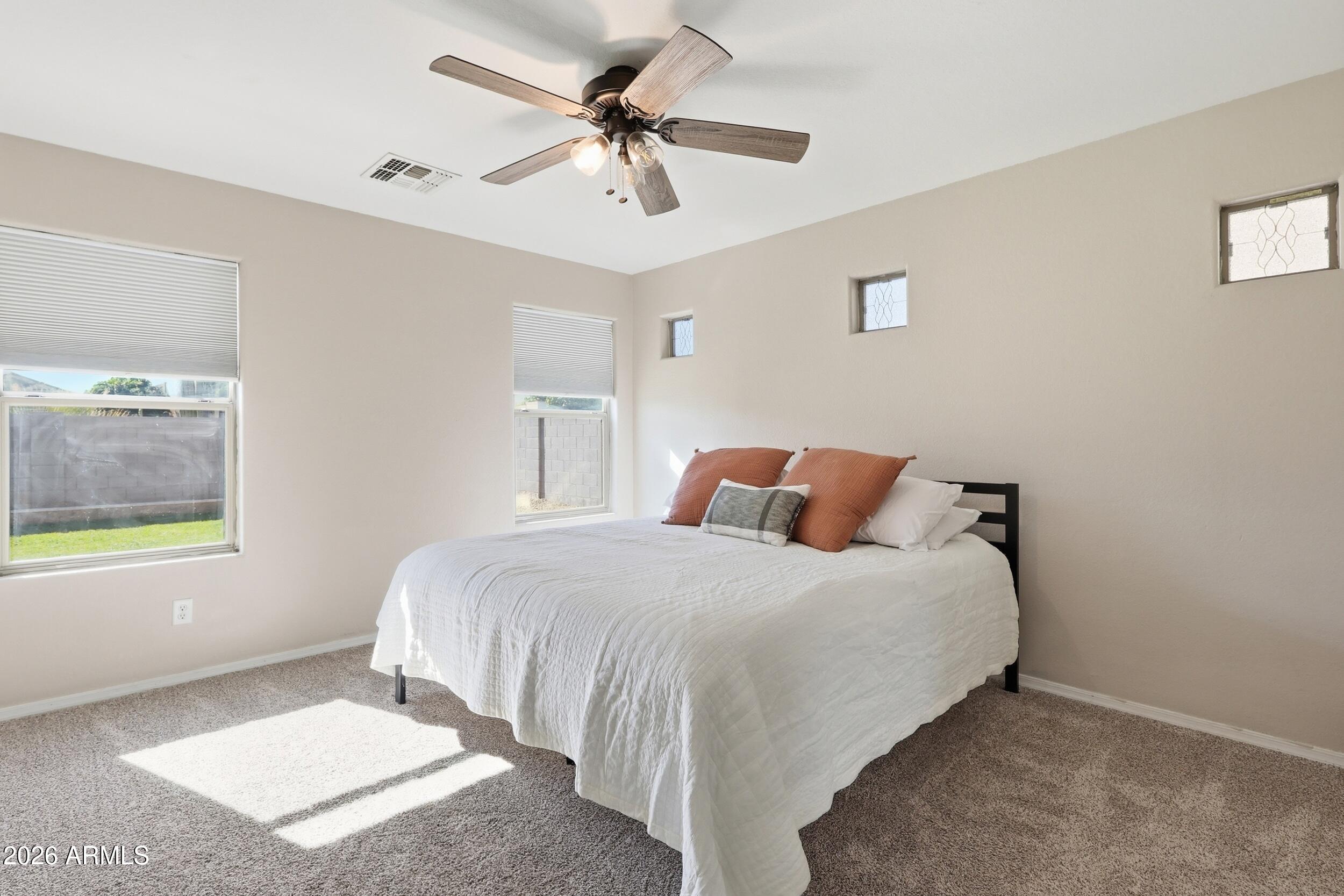 17449 West Calavar Road Surprise, AZ 85388 - Photo 17 of 33 24 - Primary Bedroom