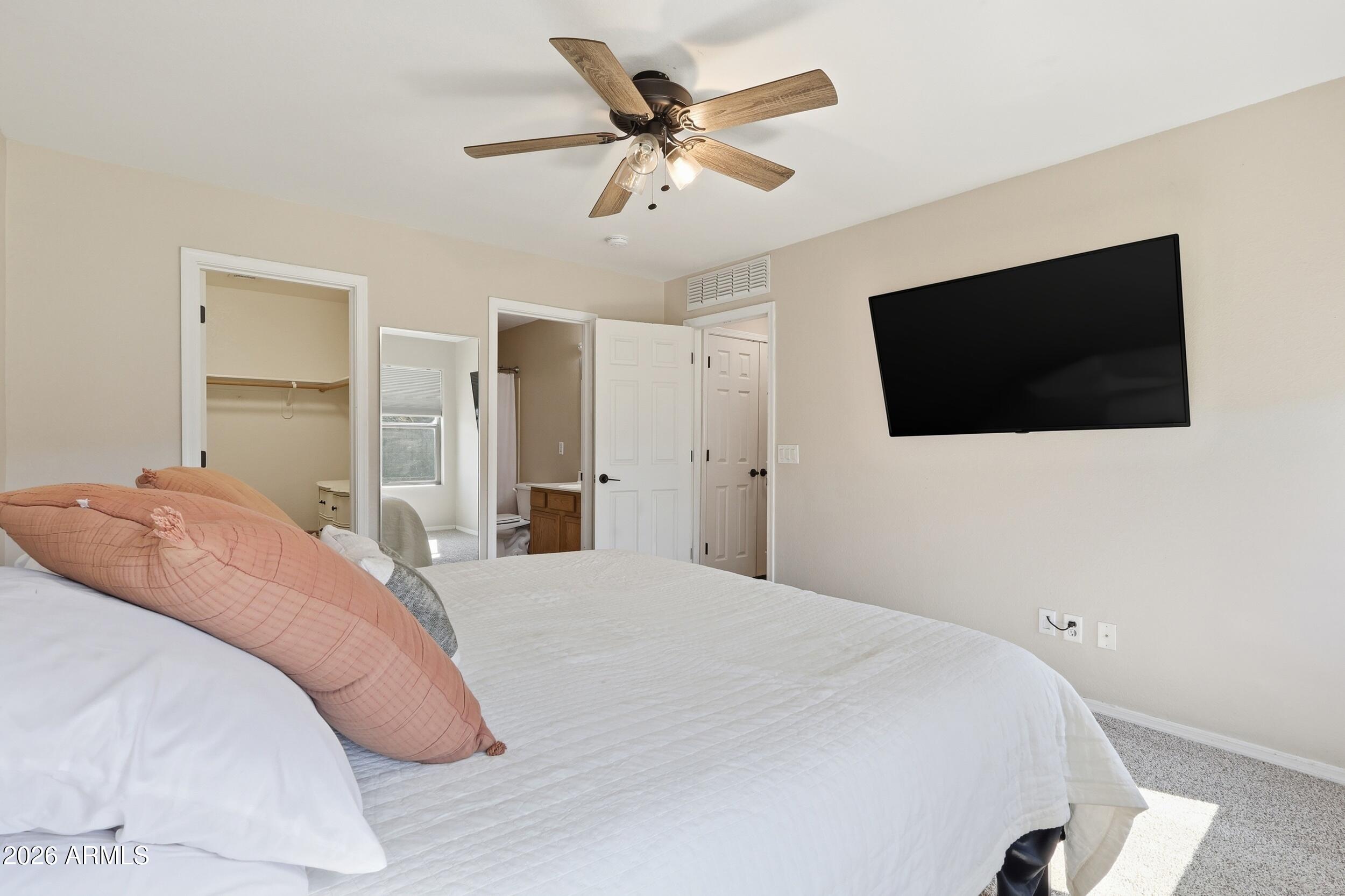 17449 West Calavar Road Surprise, AZ 85388 - Photo 18 of 33 25 - Primary Bedroom