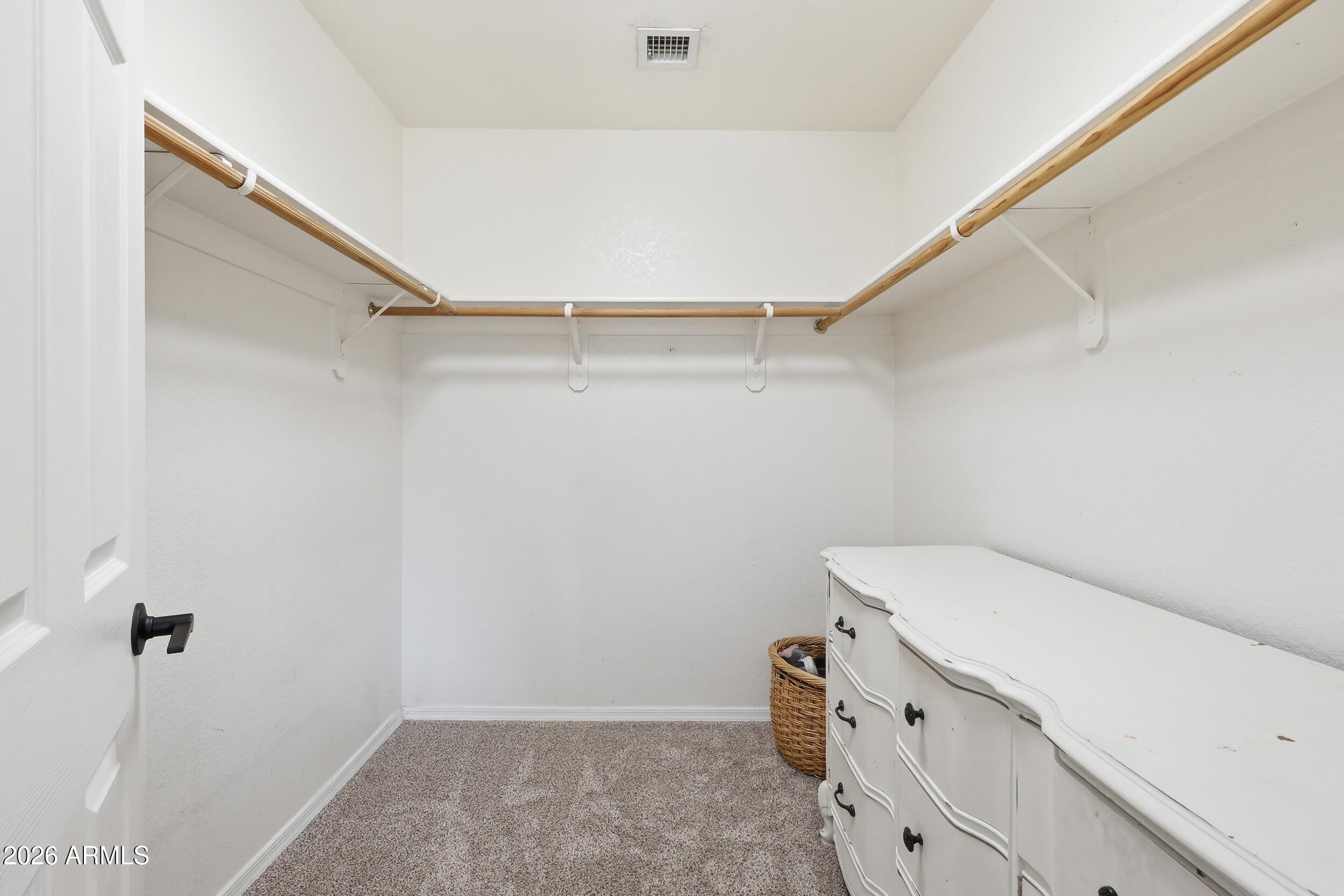 17449 West Calavar Road Surprise, AZ 85388 - Photo 20 of 33 27 - Primary Bedroom Closet