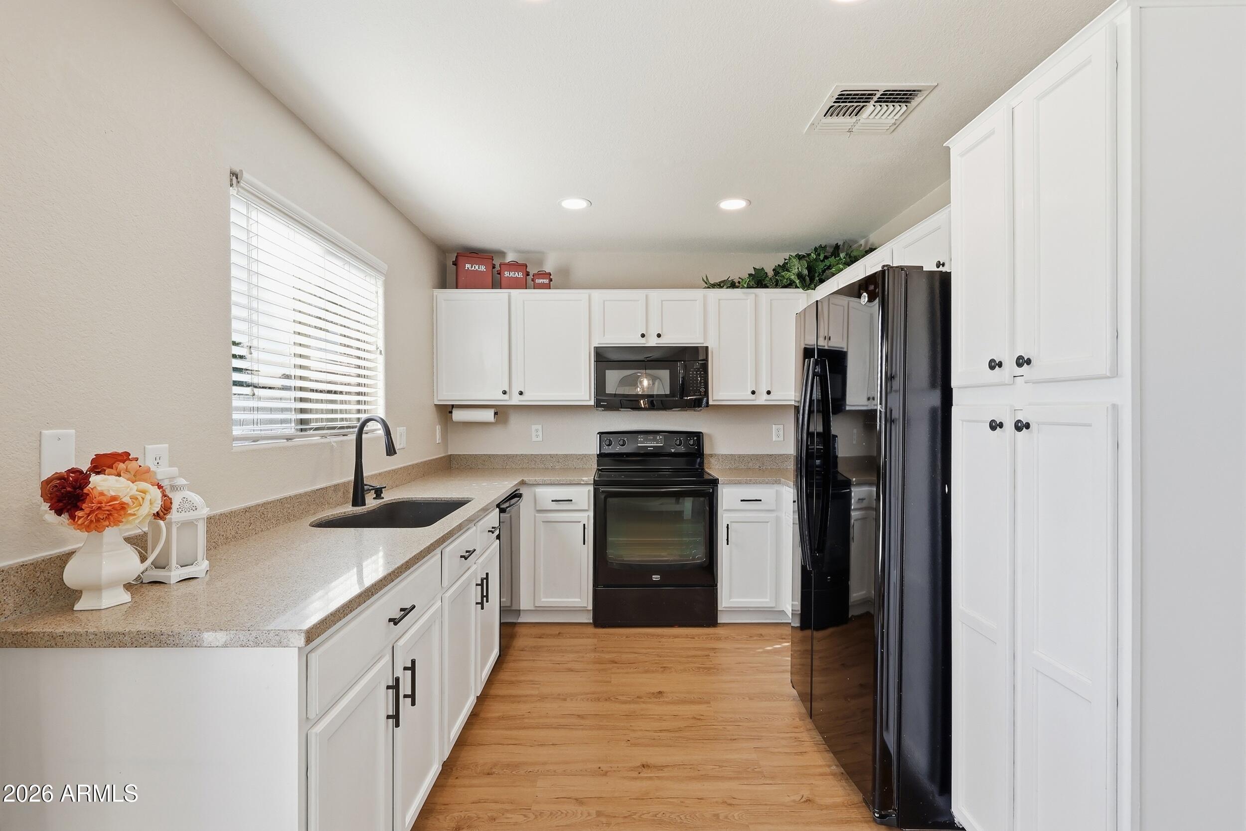17449 West Calavar Road Surprise, AZ 85388 - Photo 8 of 33 14 - Kitchen