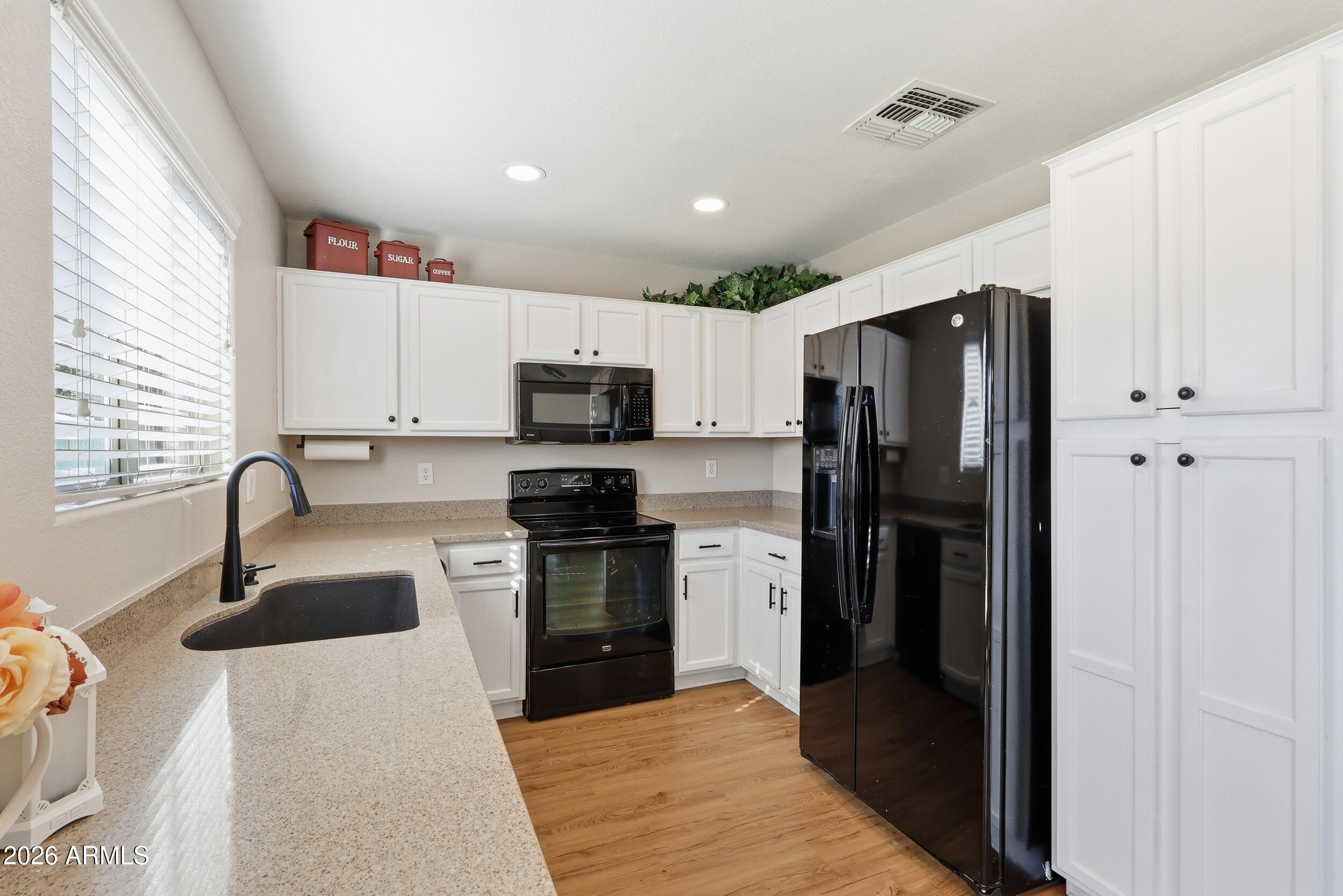 17449 West Calavar Road Surprise, AZ 85388 - Photo 9 of 33 15 - Kitchen