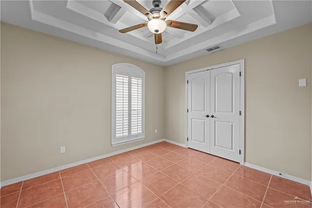 a bathroom with a granite countertop toilet a sink and a mirror