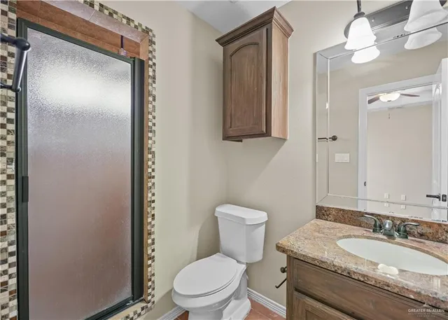 an empty room with a window and a ceiling fan