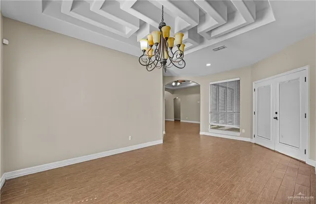 a large kitchen with granite countertop a large stove a sink and a refrigerator