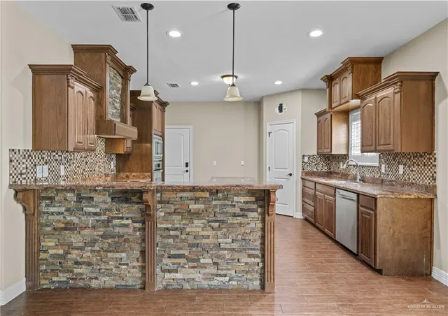 a kitchen with a stove and a microwave