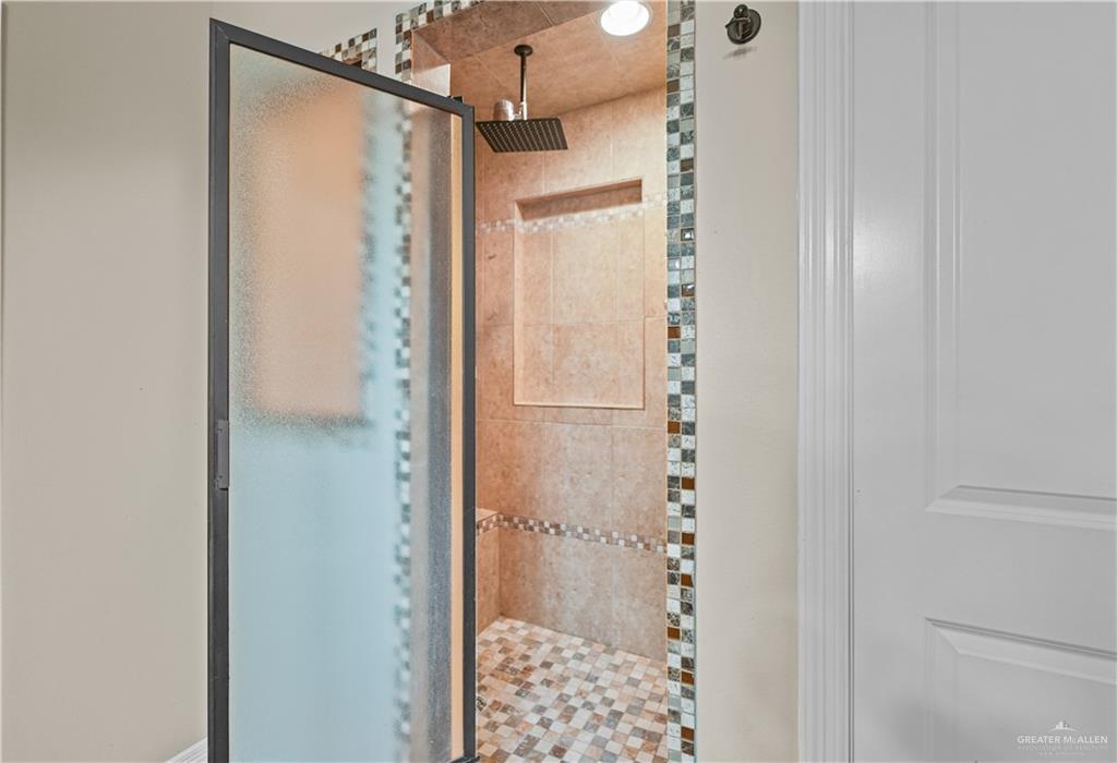 2608 Flamingo Avenue Mission, TX 78574 - Photo 10 of 27 a bathroom with a glass shower door
