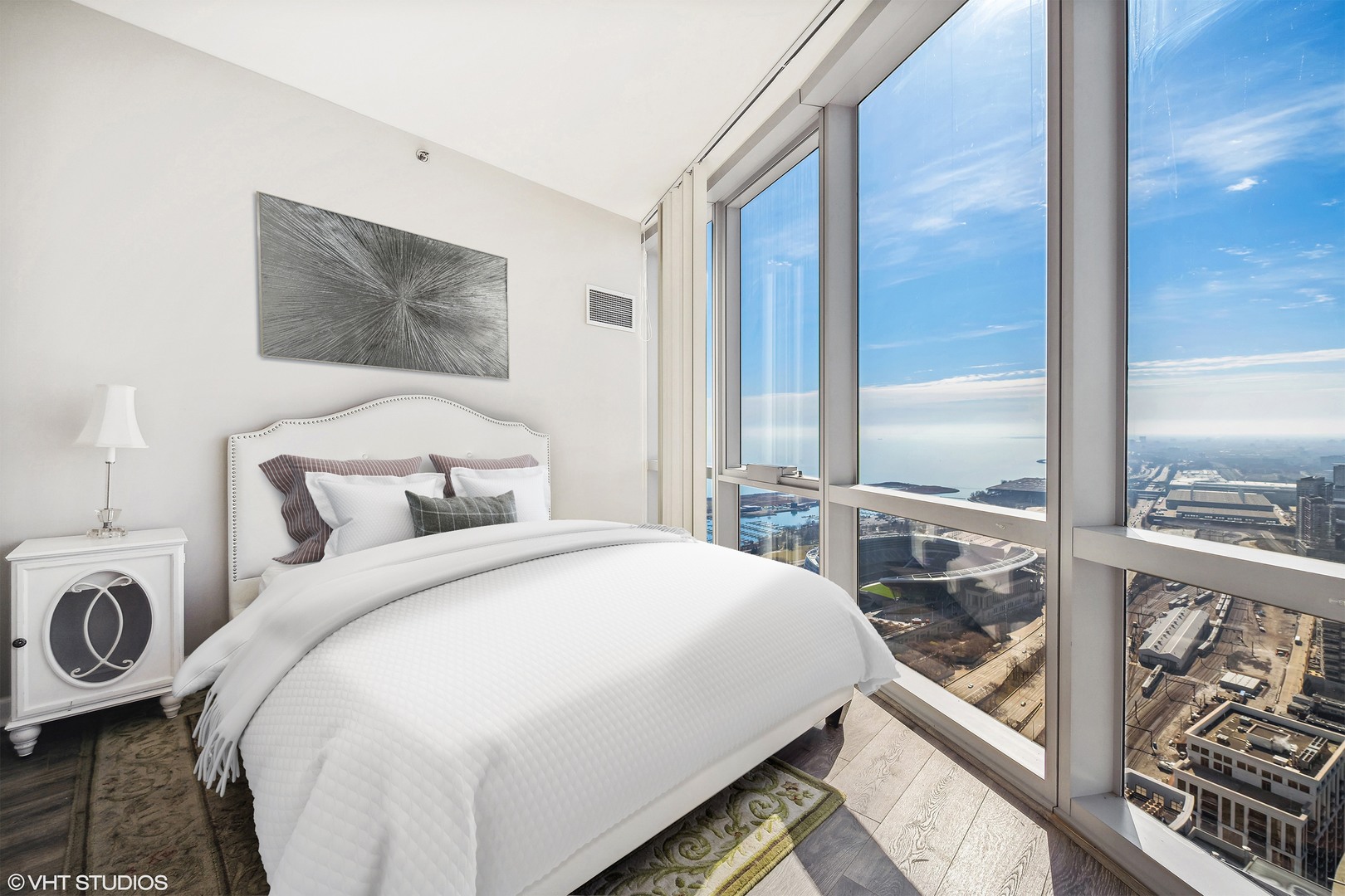 1211 South Prairie Avenue, Unit 5302 Chicago, IL 60605 - Photo 12 of 18 a bedroom with a bed and a large window with balcony view