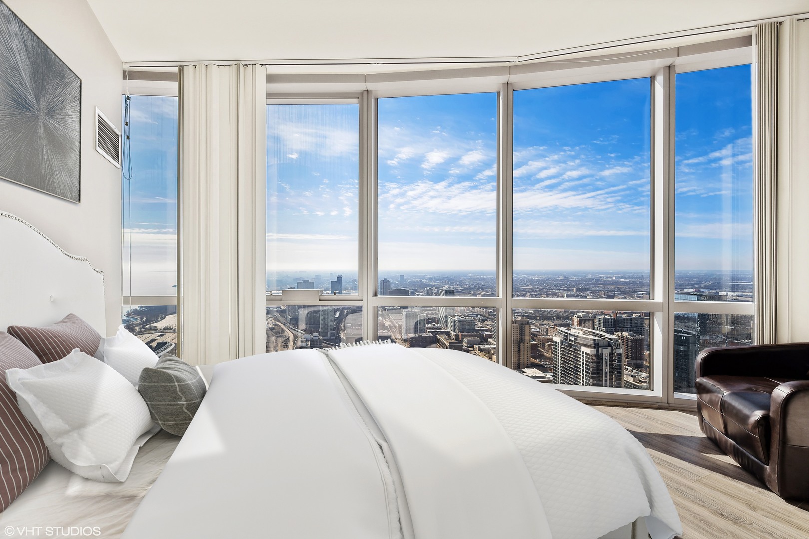 1211 South Prairie Avenue, Unit 5302 Chicago, IL 60605 - Photo 13 of 18 a bedroom with a large window and a bed