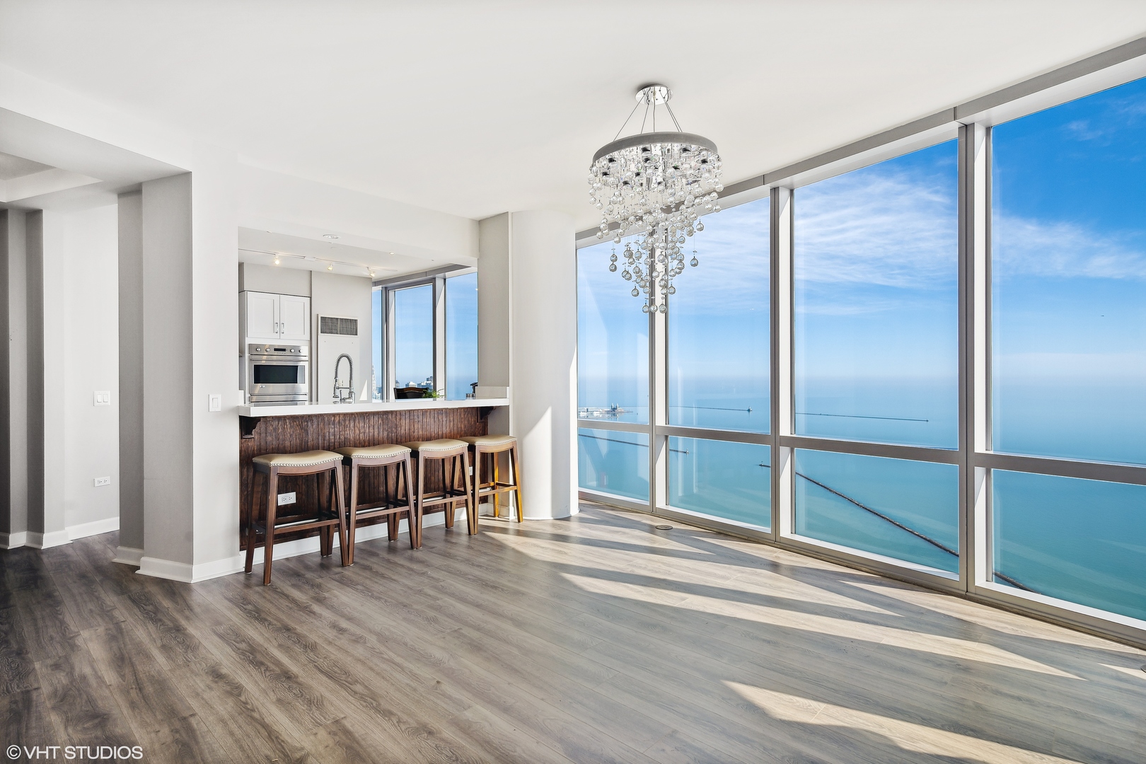 1211 South Prairie Avenue, Unit 5302 Chicago, IL 60605 - Photo 5 of 18 a dining room with furniture and wooden floor