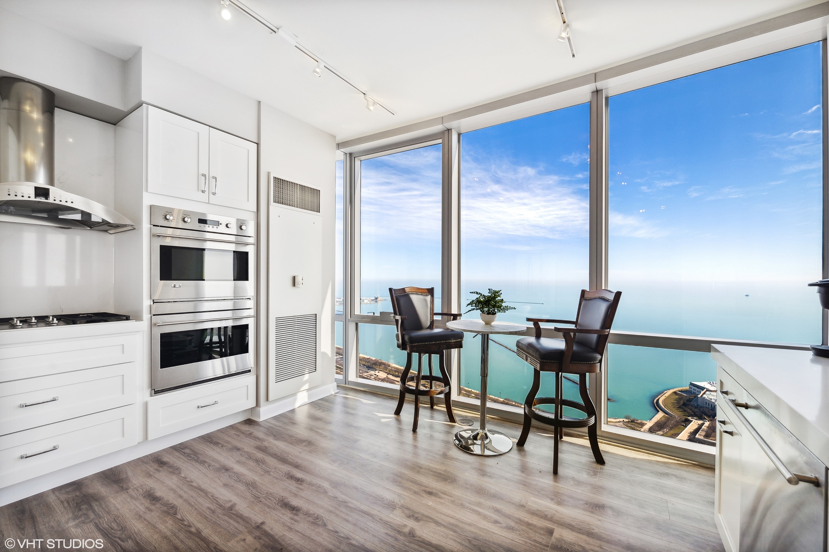 1211 South Prairie Avenue, Unit 5302 Chicago, IL 60605 - Photo 6 of 18 a view of a dining room with furniture window and wooden floor
