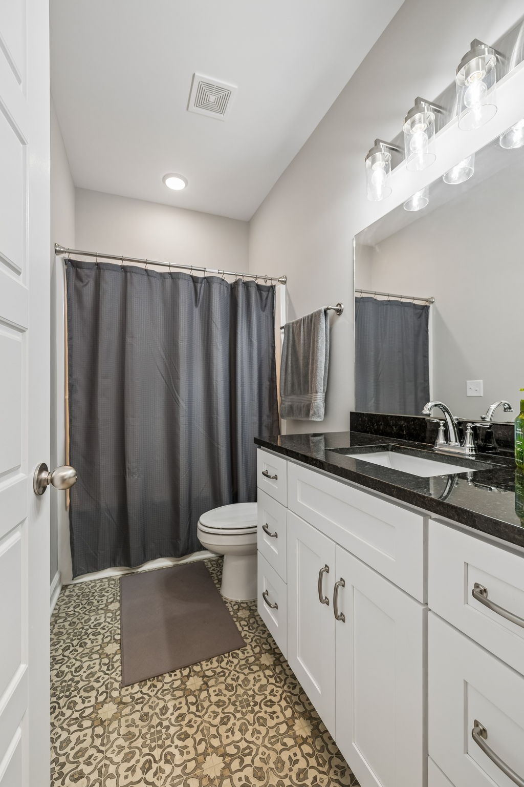 180 Vickers Hill Road Smithville, TN 37166 - Photo 24 of 33 a bathroom with a sink a toilet a mirror and shower
