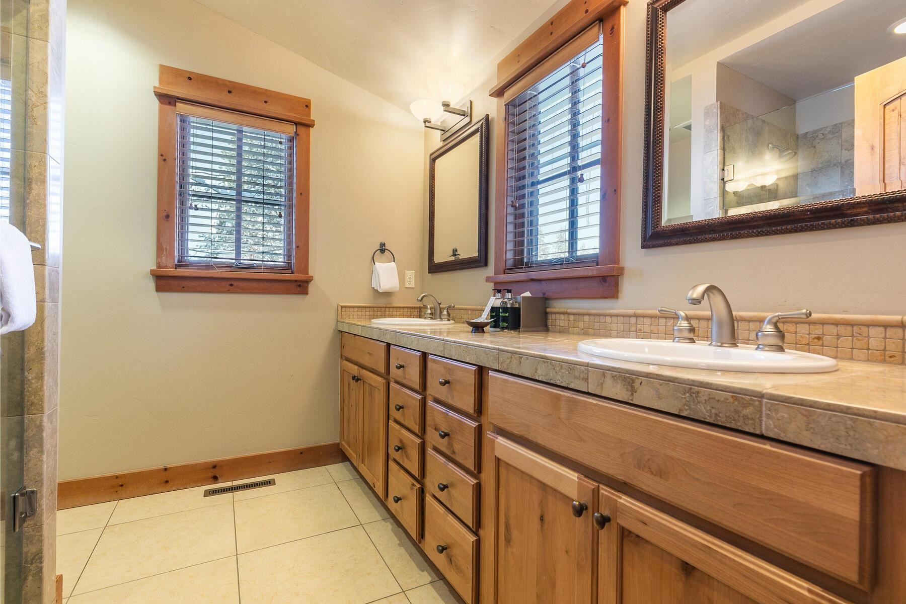 12403 Lookout Loop, Unit F1438 Truckee, CA 96161 - Photo 21 of 28 a bathroom with a sink and a mirror