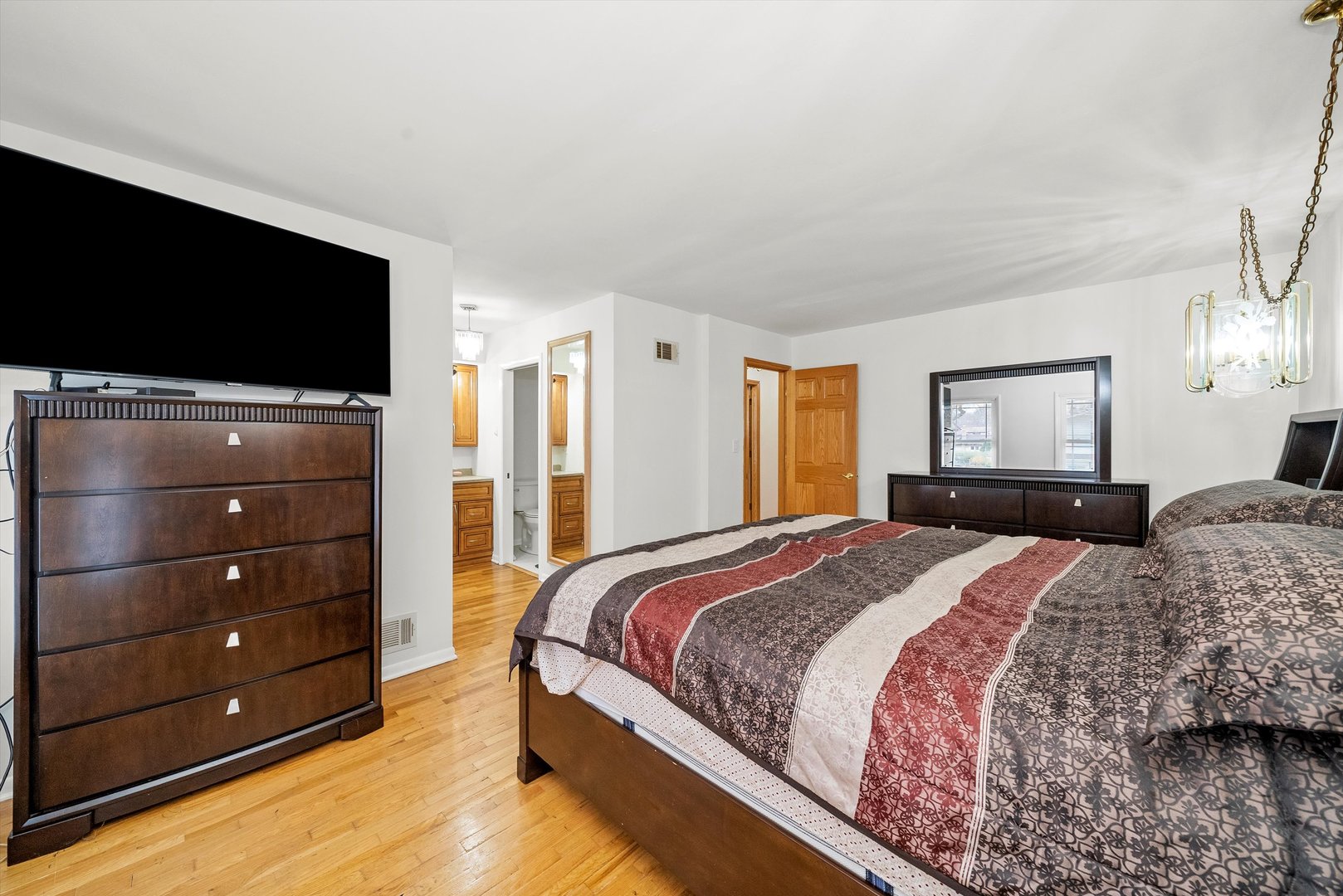 912 Sumac Lane Mount Prospect, IL 60056 - Photo 15 of 41 a bedroom with a bed and a flat screen tv