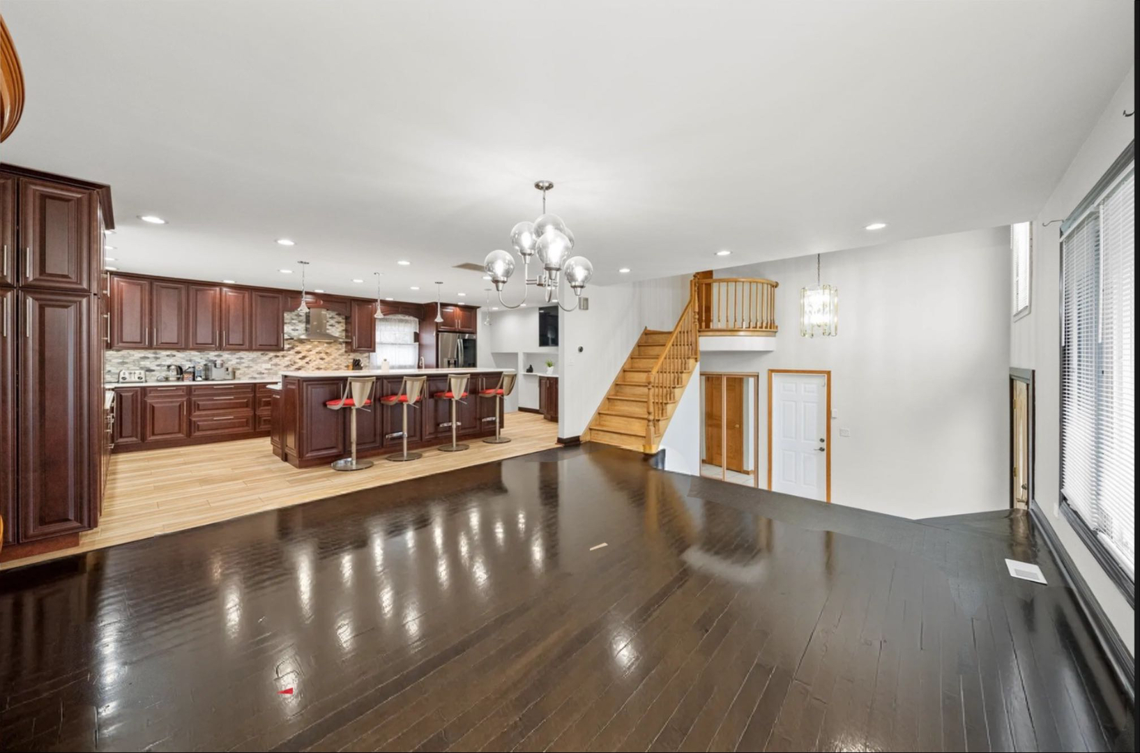 912 Sumac Lane Mount Prospect, IL 60056 - Photo 3 of 41 a view of a living room and kitchen with a large window