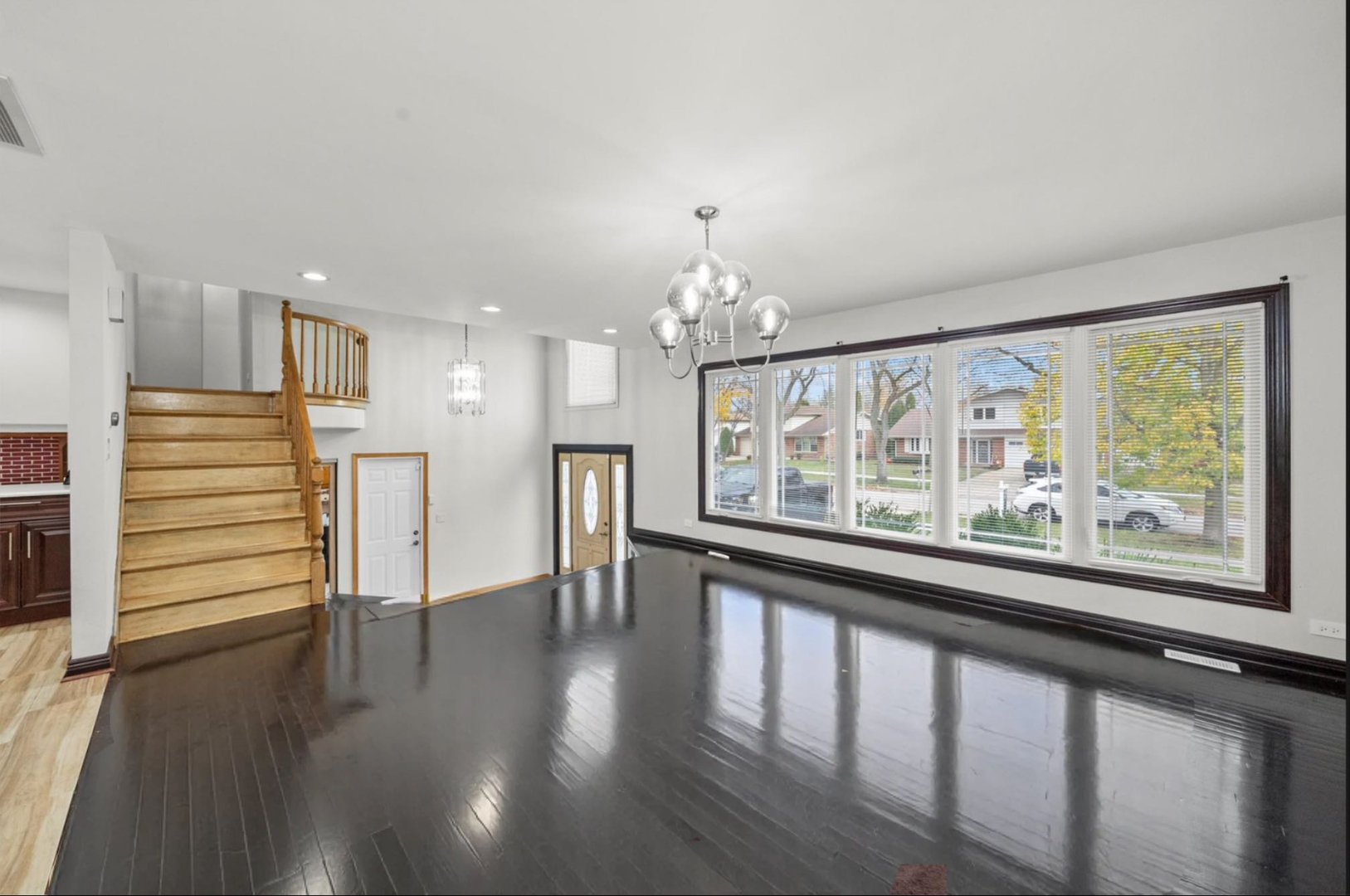 912 Sumac Lane Mount Prospect, IL 60056 - Photo 7 of 41 wooden floor in an empty room with a window