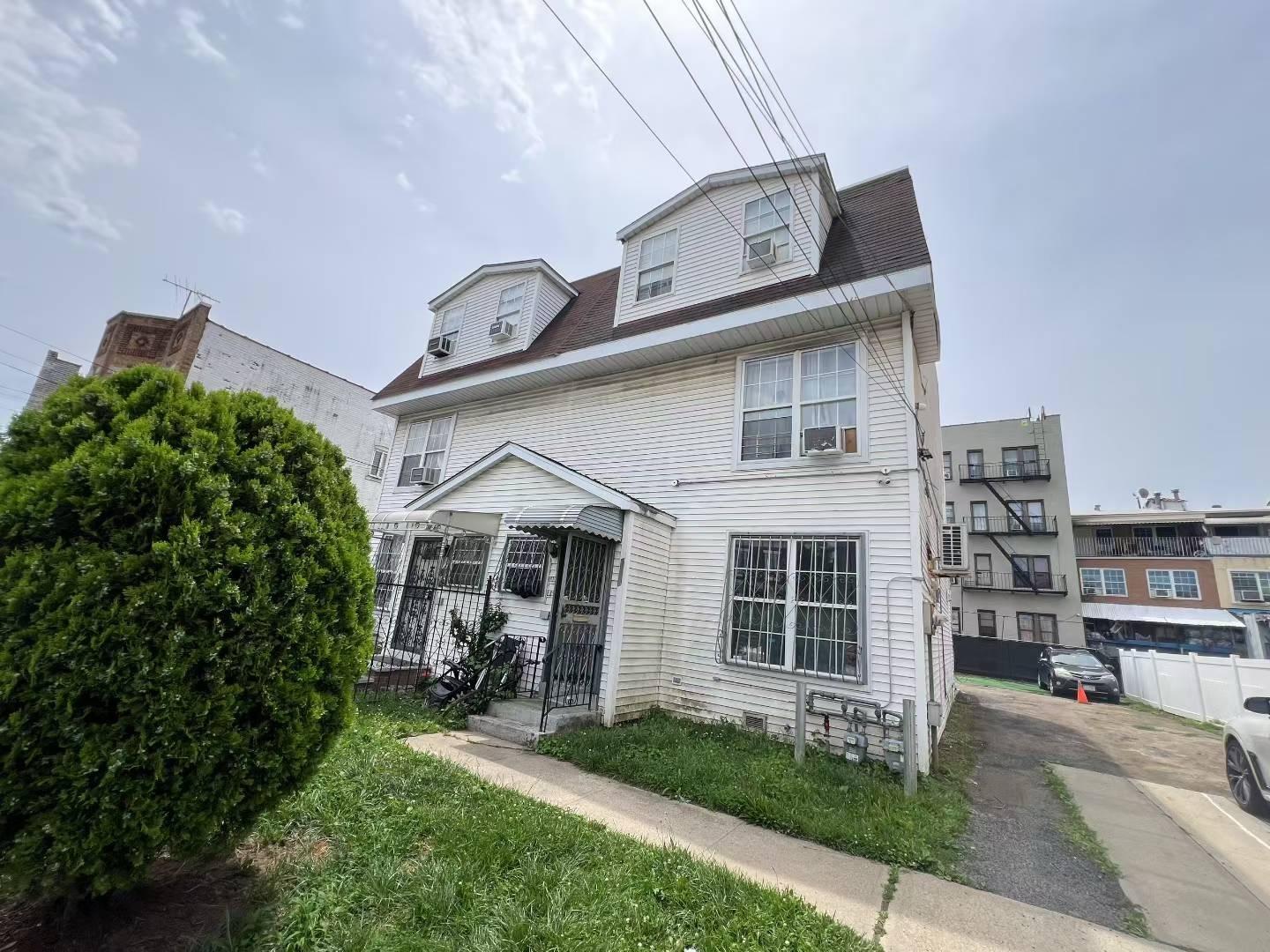 34-18 103rd Street Queens, NY 11368 - Photo 1 of 12 a front view of a house with a yard