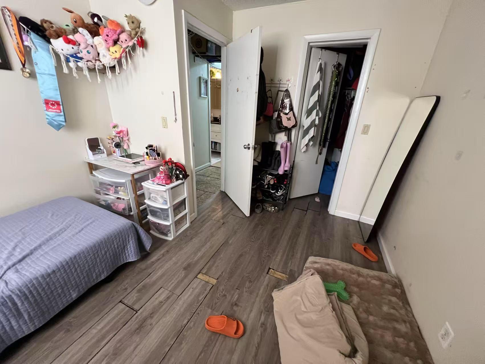 34-18 103rd Street Queens, NY 11368 - Photo 12 of 12 a bedroom with bed and a couch