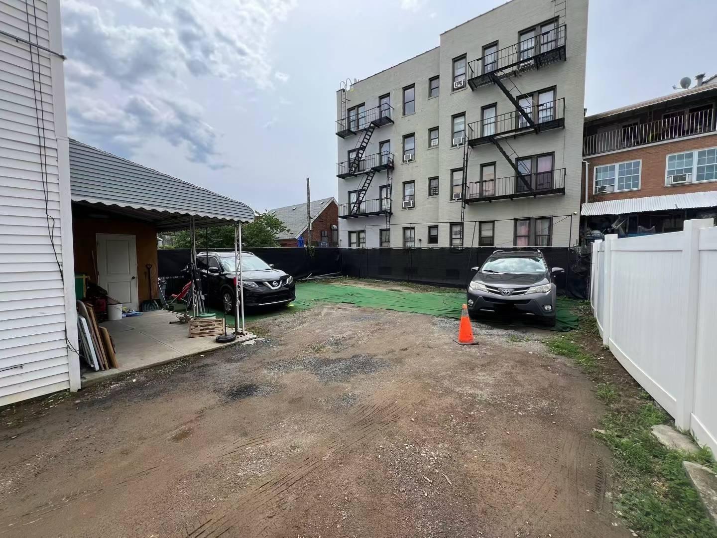34-18 103rd Street Queens, NY 11368 - Photo 3 of 12 a view of a car park in front of house