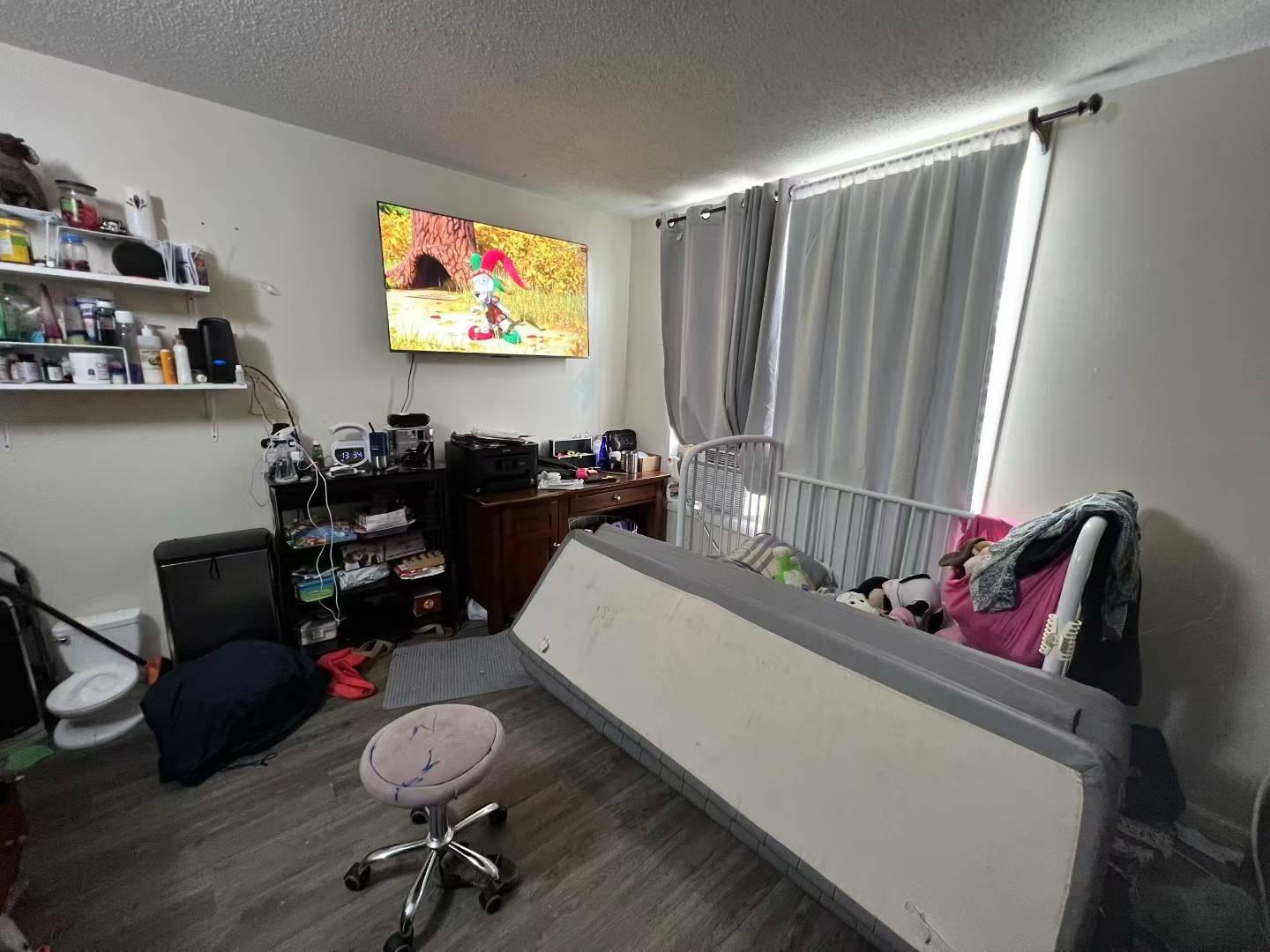 34-18 103rd Street Queens, NY 11368 - Photo 7 of 12 a living room with furniture and a flat screen tv