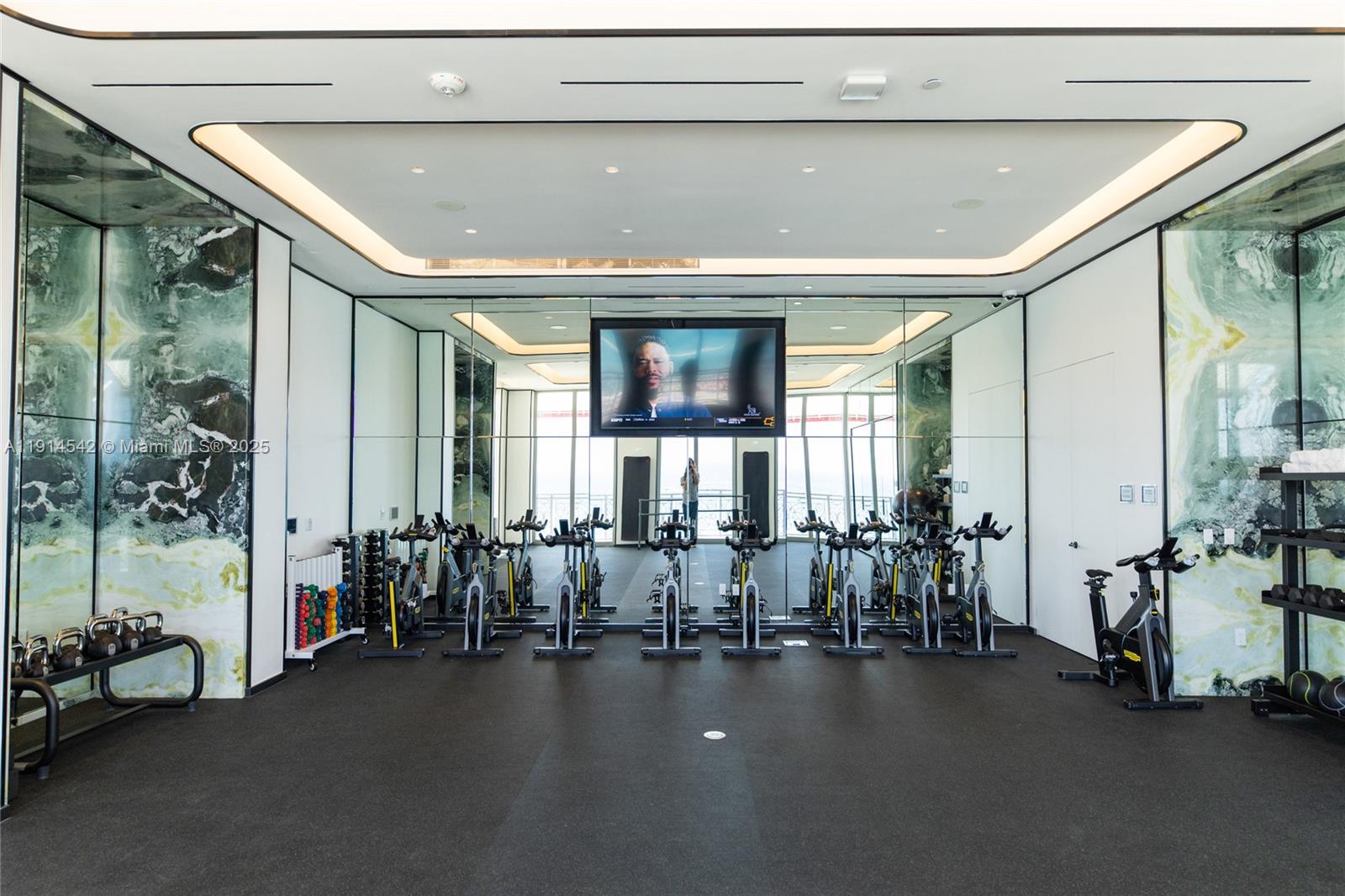 17901 Collins Avenue, Unit TS3405/07 Sunny Isles Beach, FL 33160 - Photo 40 of 47 a hallway with a large mirror and fan