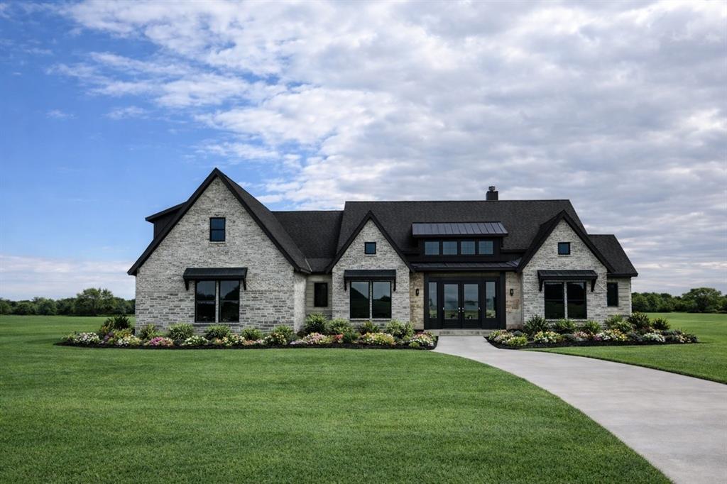 1084 Woodland Road Weatherford, TX 76088 - Photo 1 of 1 a front view of house with yard and green space