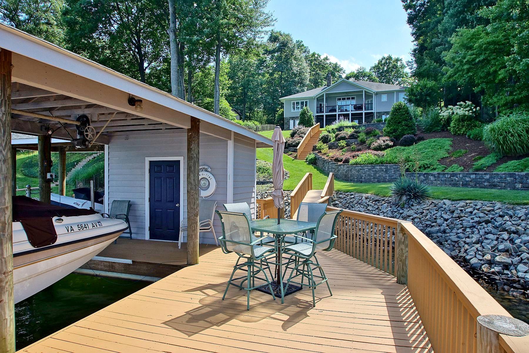 1210 Jefferson Dock Road Penhook, VA 24137 - Photo 14 of 74 a view of a patio with a table chairs and backyard