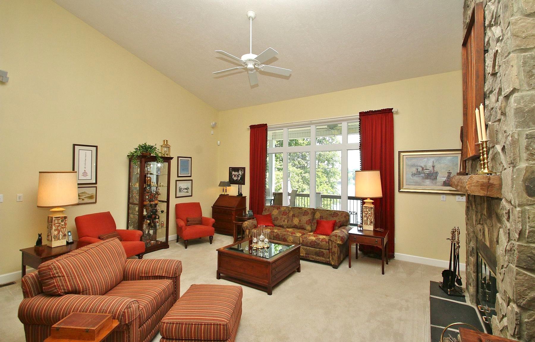 1210 Jefferson Dock Road Penhook, VA 24137 - Photo 22 of 74 a living room with furniture and a large window