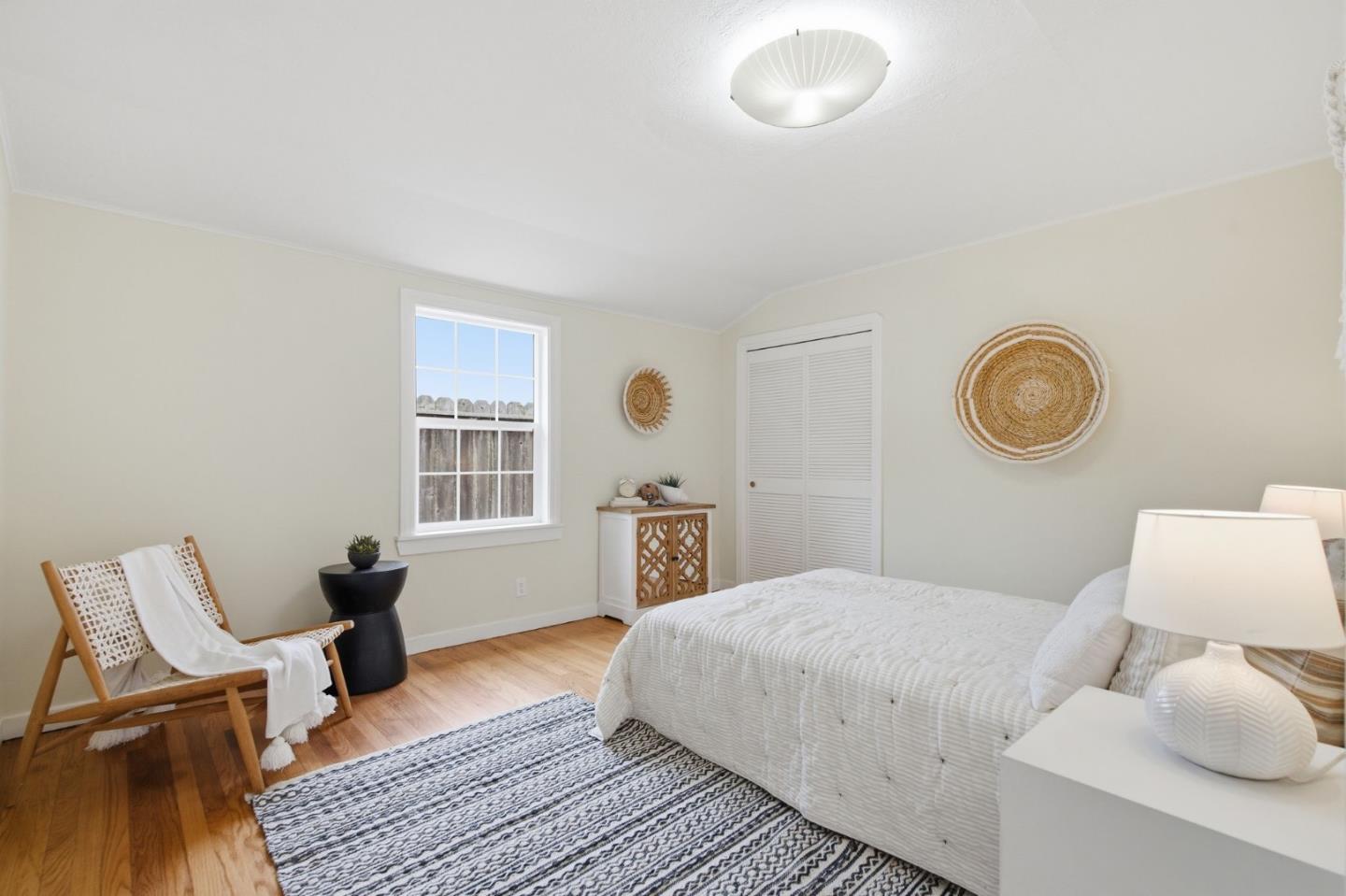 1263 Reservoir Road Pescadero, CA 94060 - Photo 27 of 66 a bedroom with a bed and a lamp on dresser