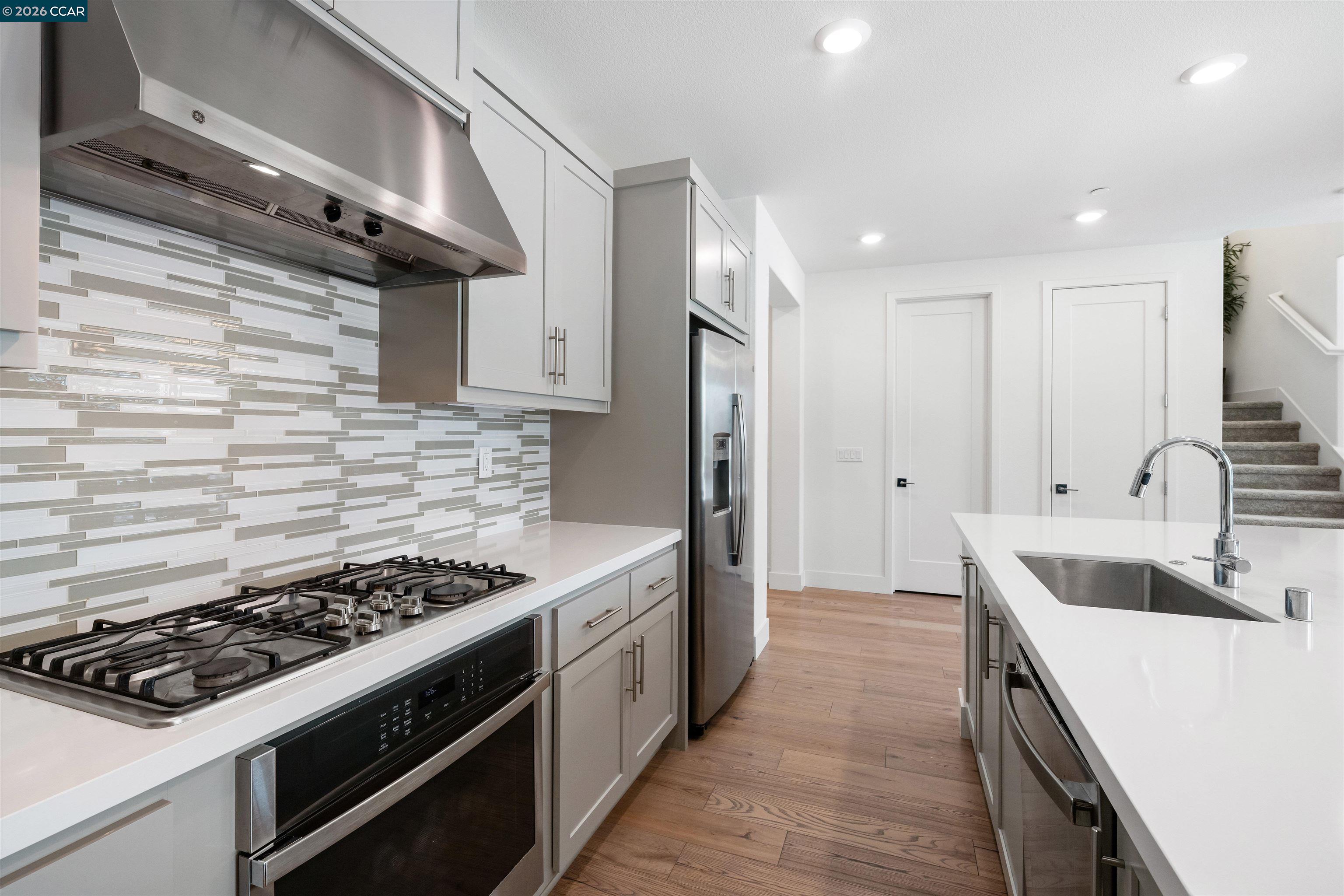 6274 Carousel Avenue Tracy, CA 95377 - Photo 12 of 46 a kitchen that has a sink and a stove