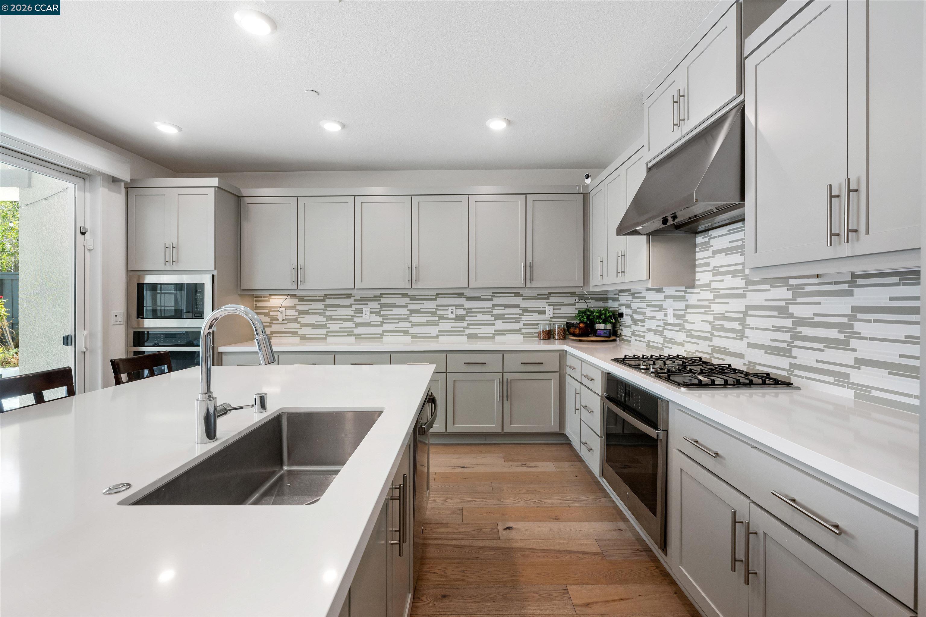 6274 Carousel Avenue Tracy, CA 95377 - Photo 13 of 46 a kitchen with a sink stove top oven and cabinets
