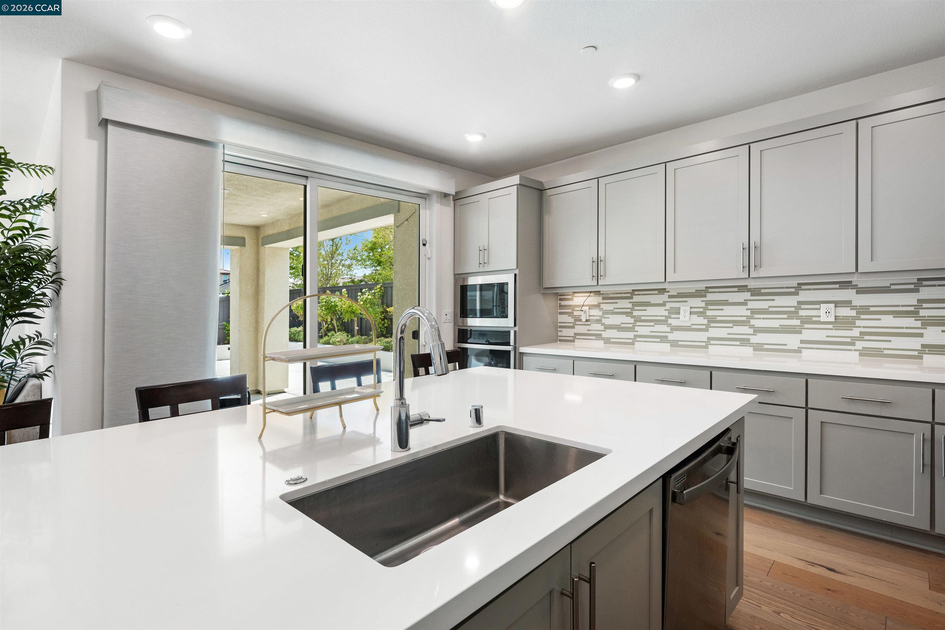 6274 Carousel Avenue Tracy, CA 95377 - Photo 14 of 46 a kitchen with a sink and large window