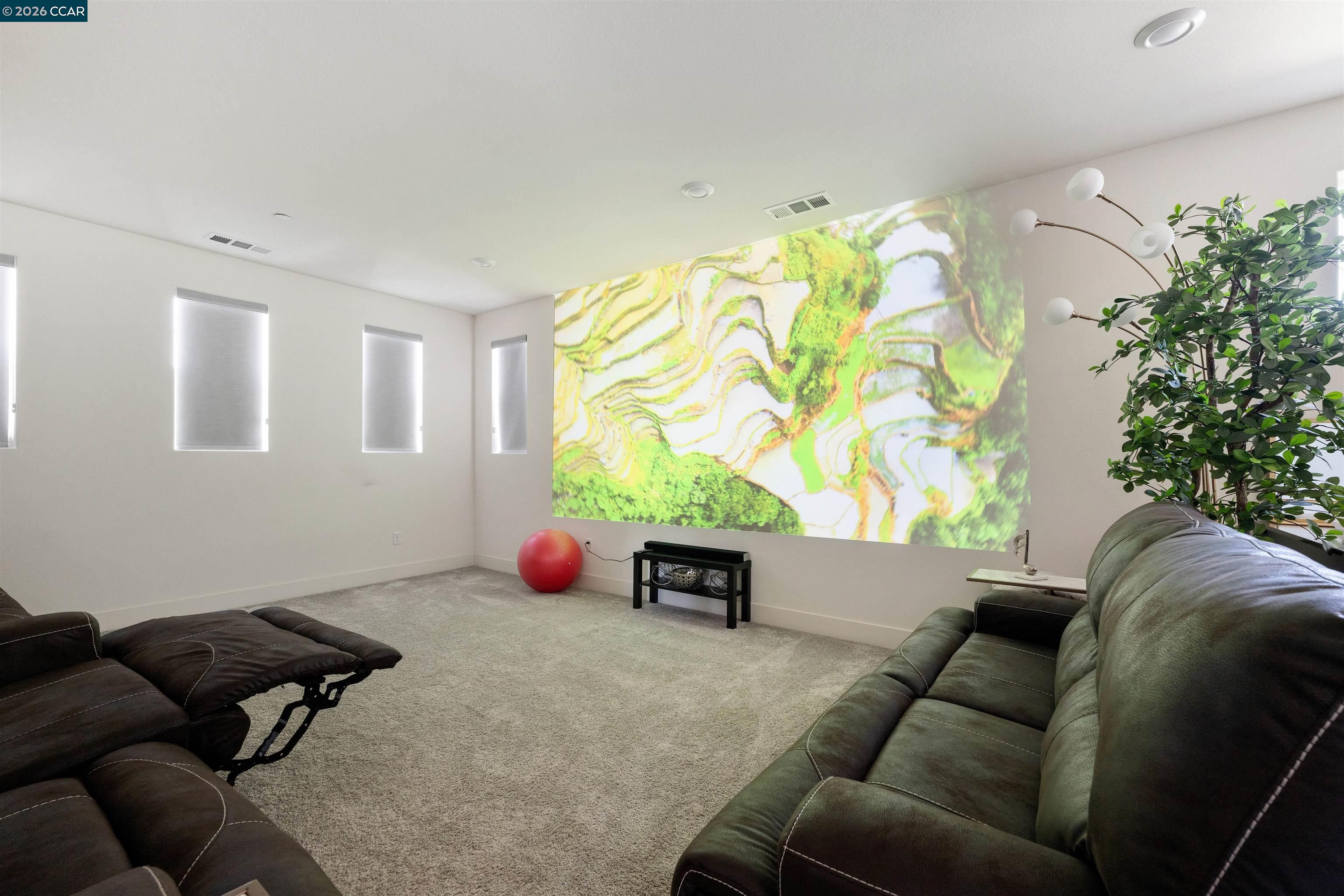 6274 Carousel Avenue Tracy, CA 95377 - Photo 20 of 46 a living room with furniture and a potted plant