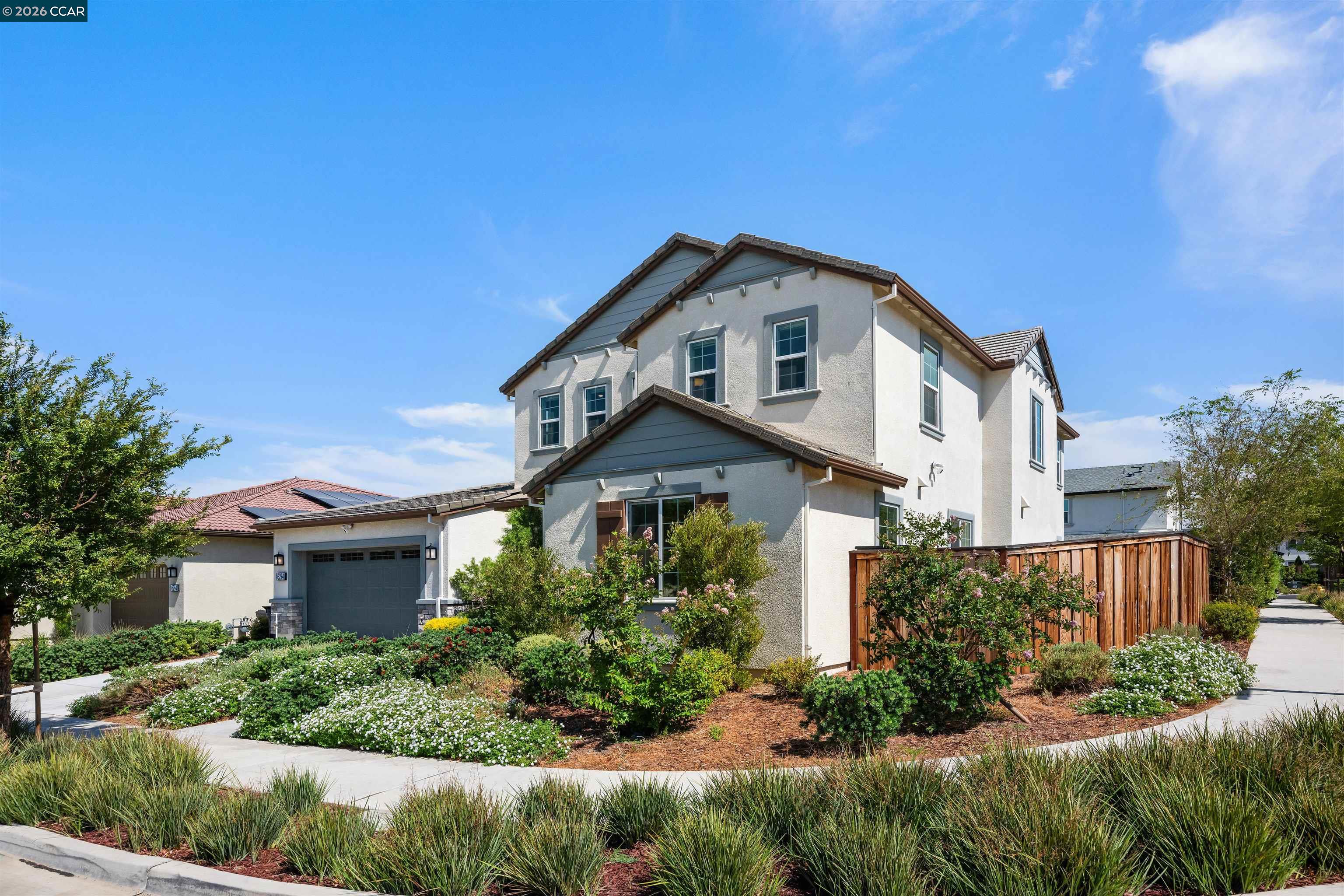 6274 Carousel Avenue Tracy, CA 95377 - Photo 2 of 46 a front view of a house with a yard