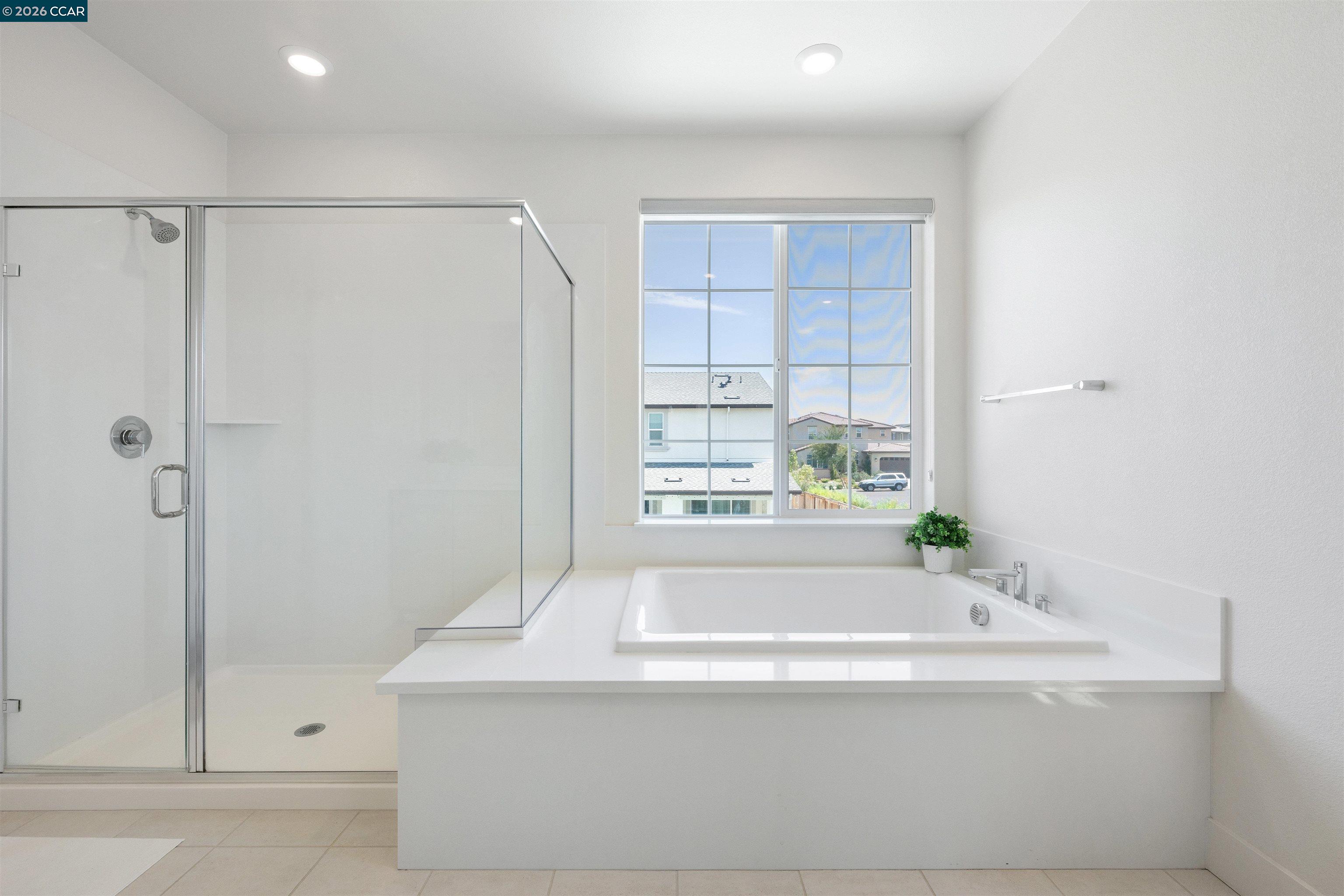 6274 Carousel Avenue Tracy, CA 95377 - Photo 28 of 46 a bathroom with a bathtub and a shower