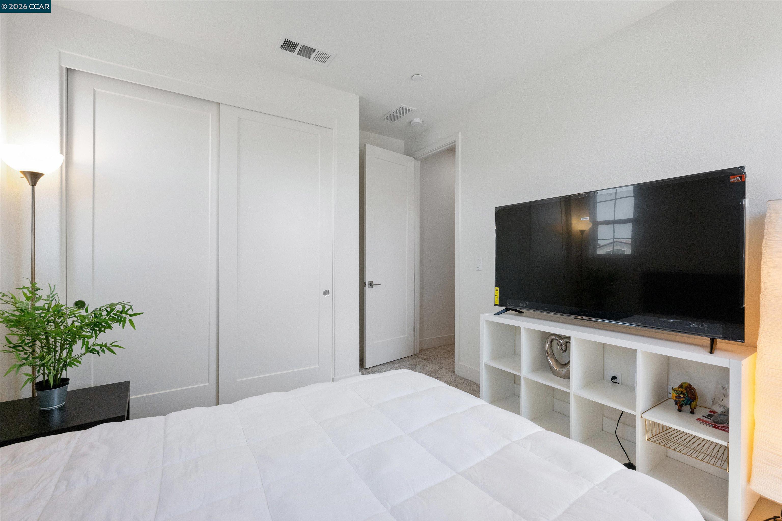 6274 Carousel Avenue Tracy, CA 95377 - Photo 33 of 46 a bedroom with a bed and a flat screen tv