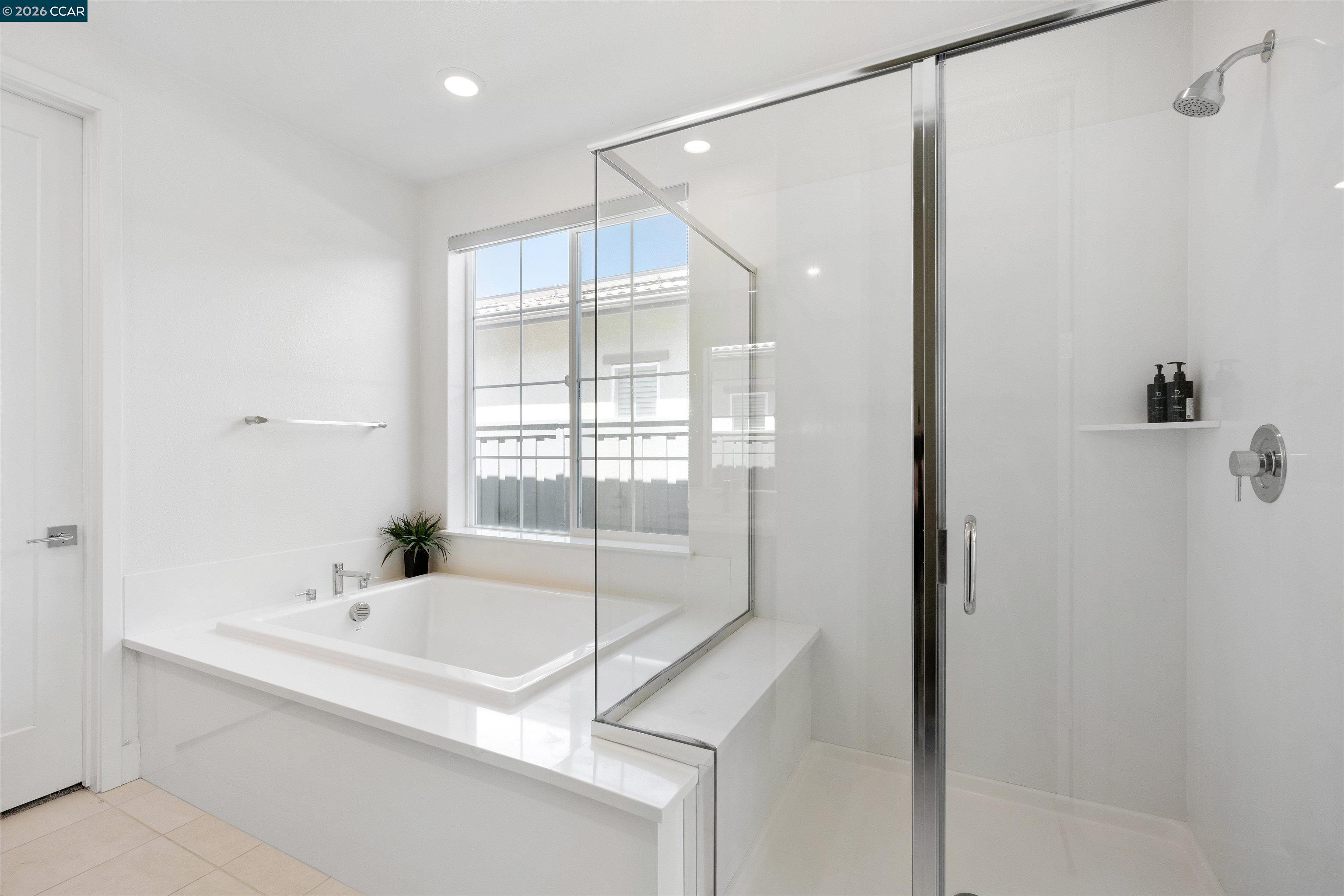 6274 Carousel Avenue Tracy, CA 95377 - Photo 40 of 46 a bathroom with a granite countertop bathtub shower sink and vanity