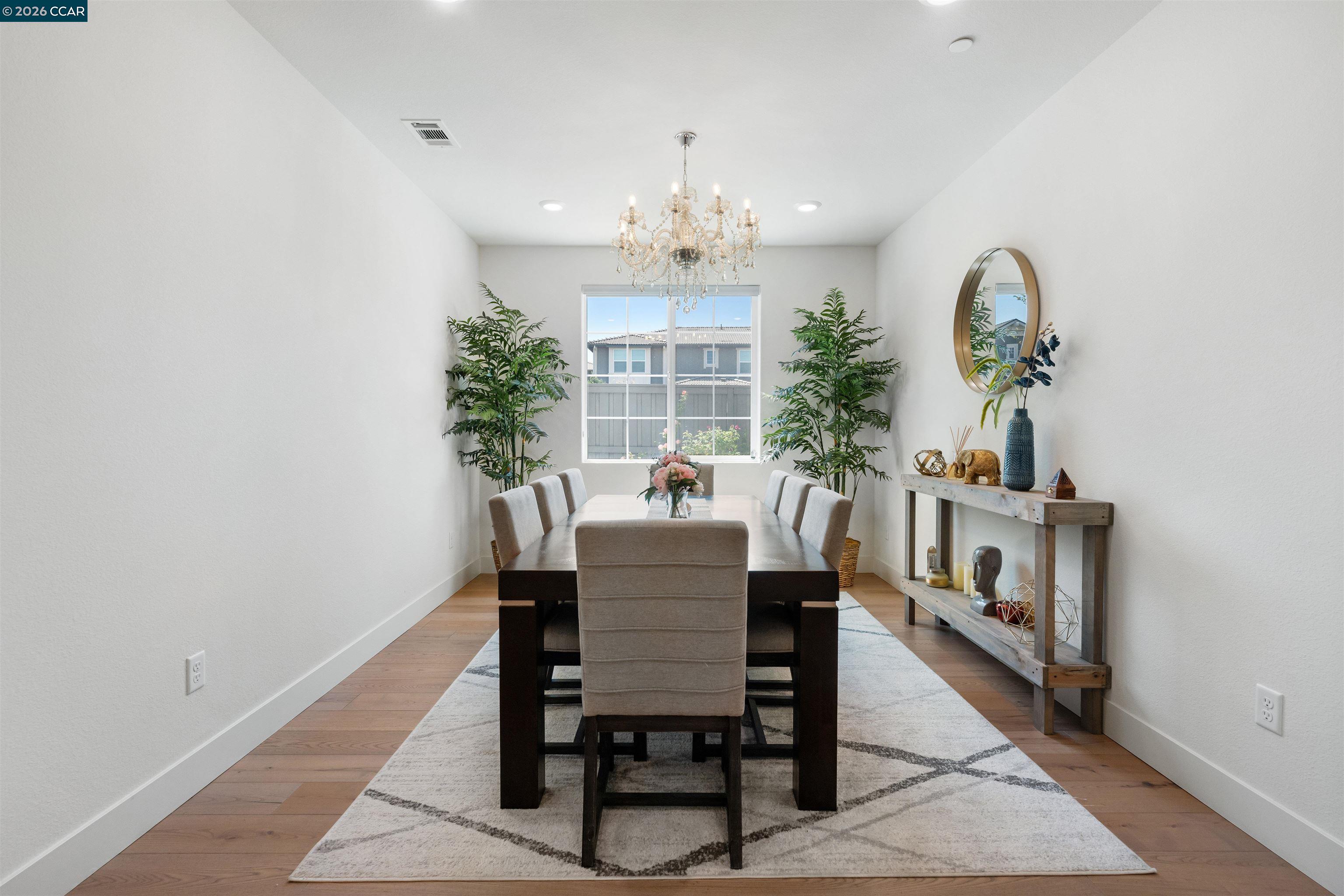 6274 Carousel Avenue Tracy, CA 95377 - Photo 4 of 46 a view of a dining room with furniture and a chandelier