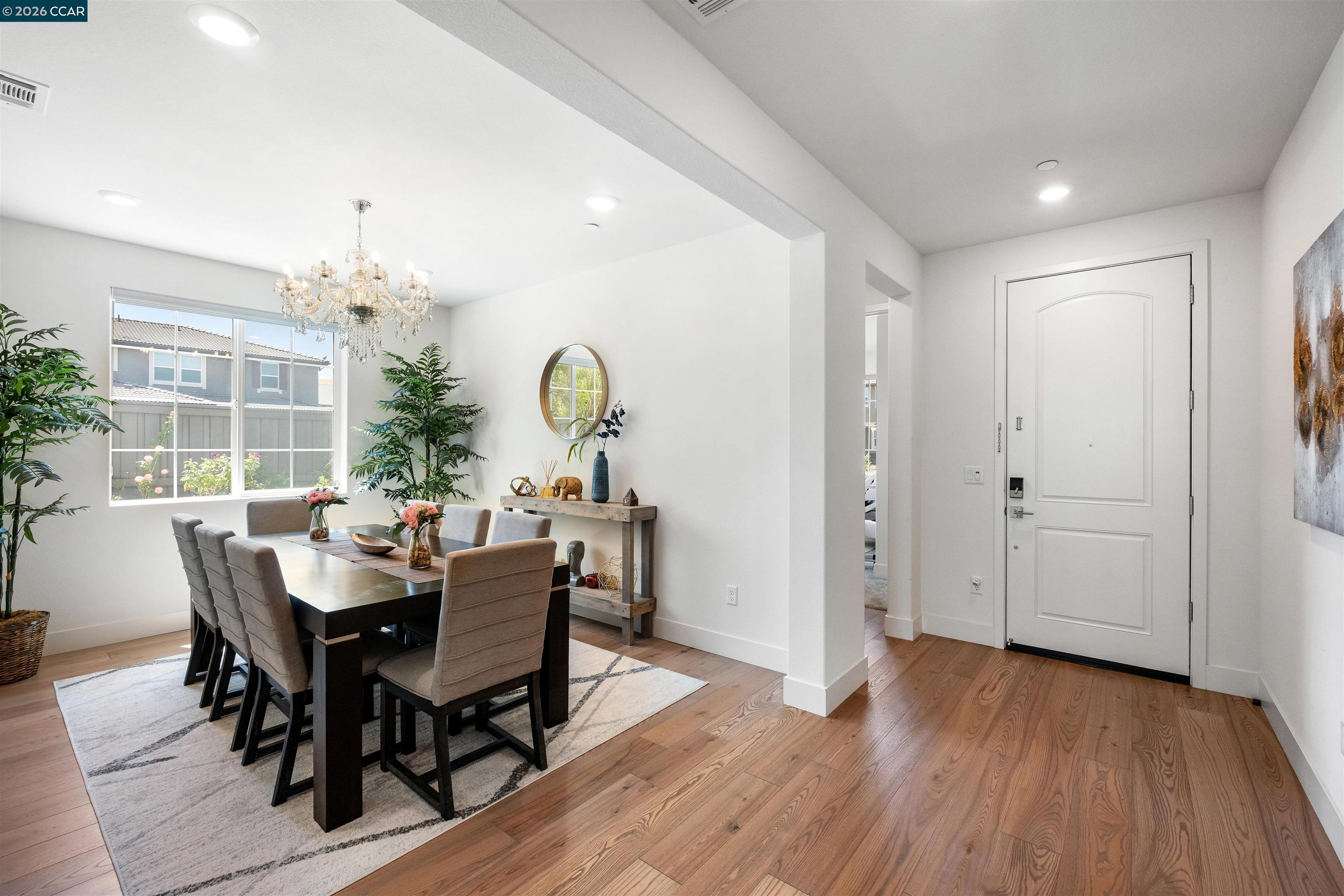 6274 Carousel Avenue Tracy, CA 95377 - Photo 5 of 46 a view of a dining room with furniture and wooden floor