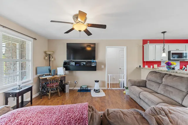 a living room with furniture and a flat screen tv