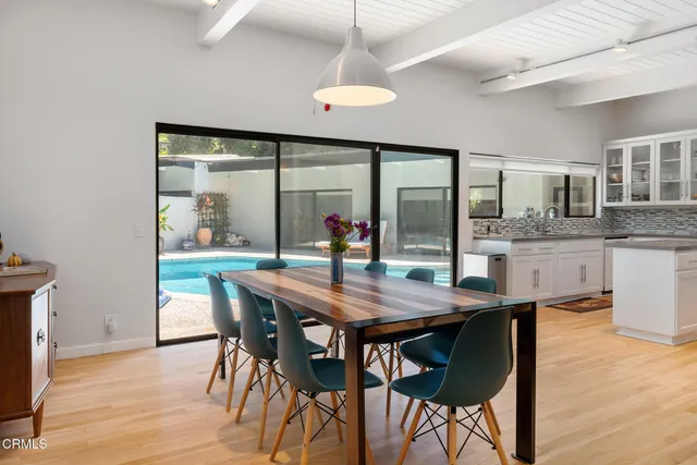 a view of a chairs and table in the balcony