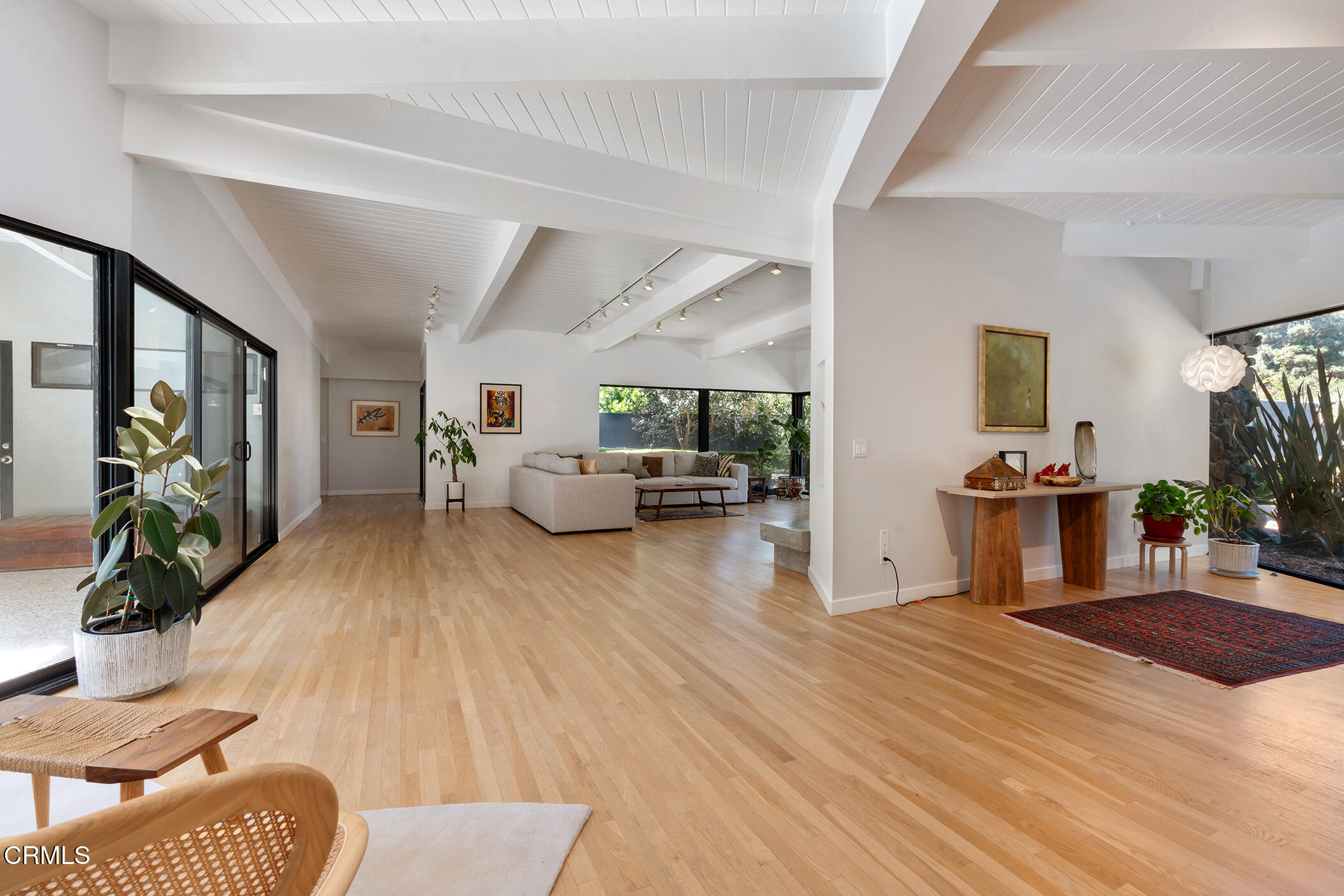 3581 Valley Meadow Road Sherman Oaks, CA 91403 - Photo 4 of 30 a living room with furniture and a wooden floor