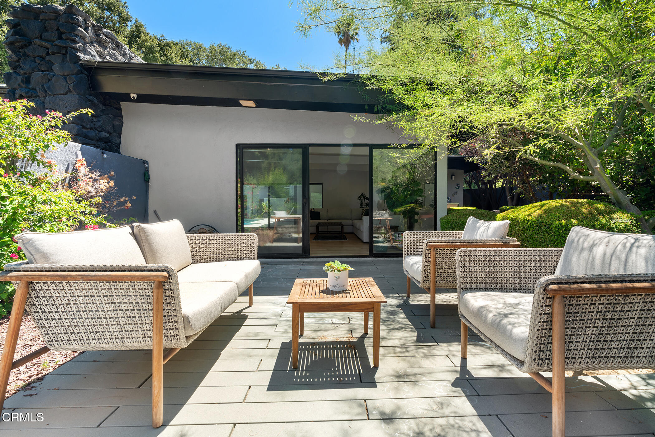 3581 Valley Meadow Road Sherman Oaks, CA 91403 - Photo 7 of 30 a view of a patio with couches table and chairs and potted plants