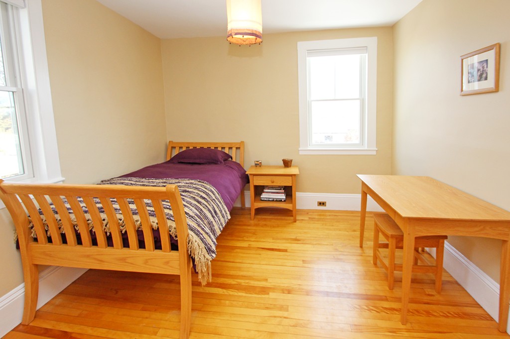 346 Merrimac Street Newburyport, MA 01950 - Photo 13 of 30 a bedroom with a bed and a table in it