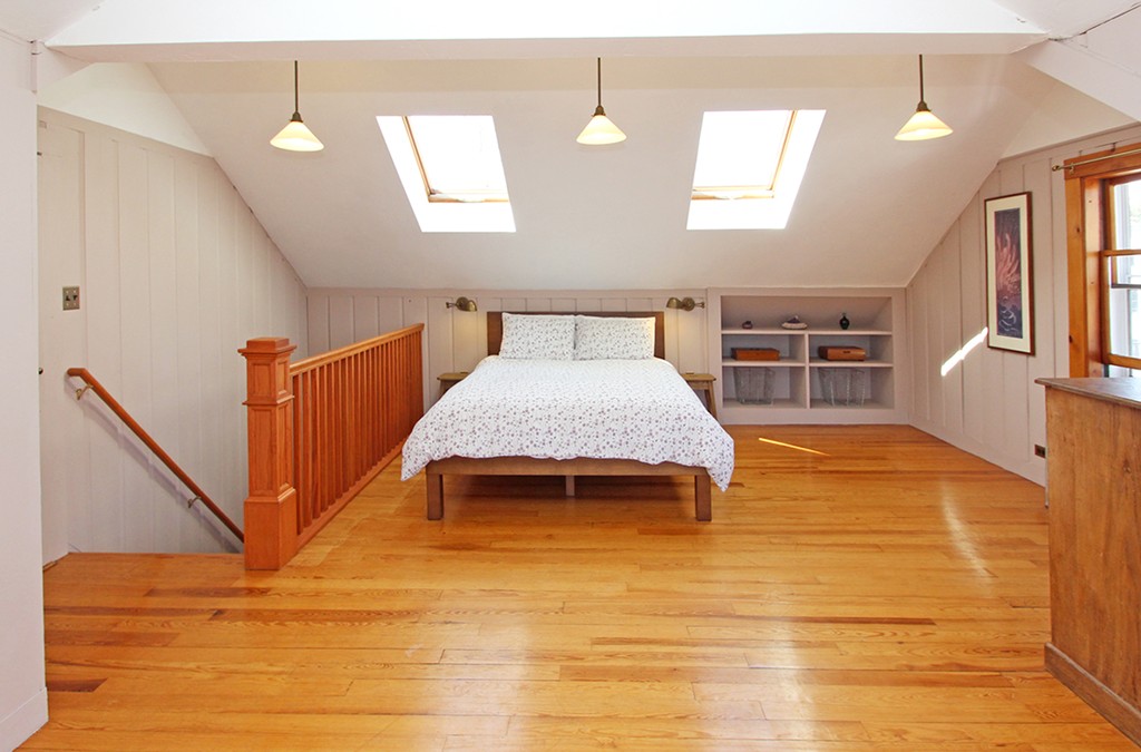 346 Merrimac Street Newburyport, MA 01950 - Photo 18 of 30 a bedroom with a bed and wooden floor