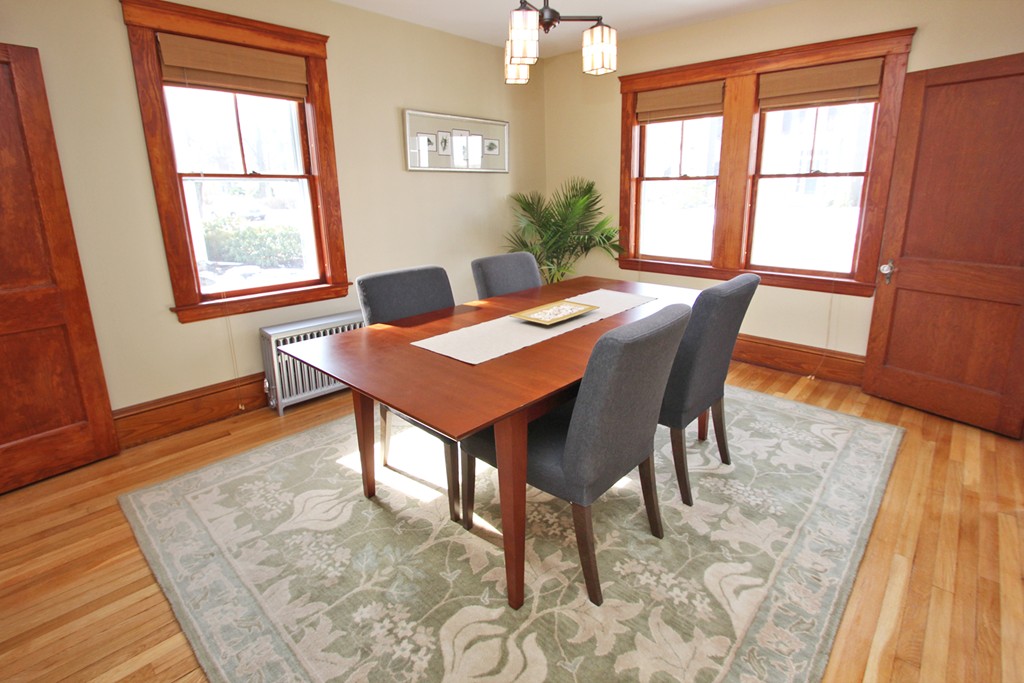 346 Merrimac Street Newburyport, MA 01950 - Photo 10 of 30 a view of a dining room with furniture a rug and wooden floor